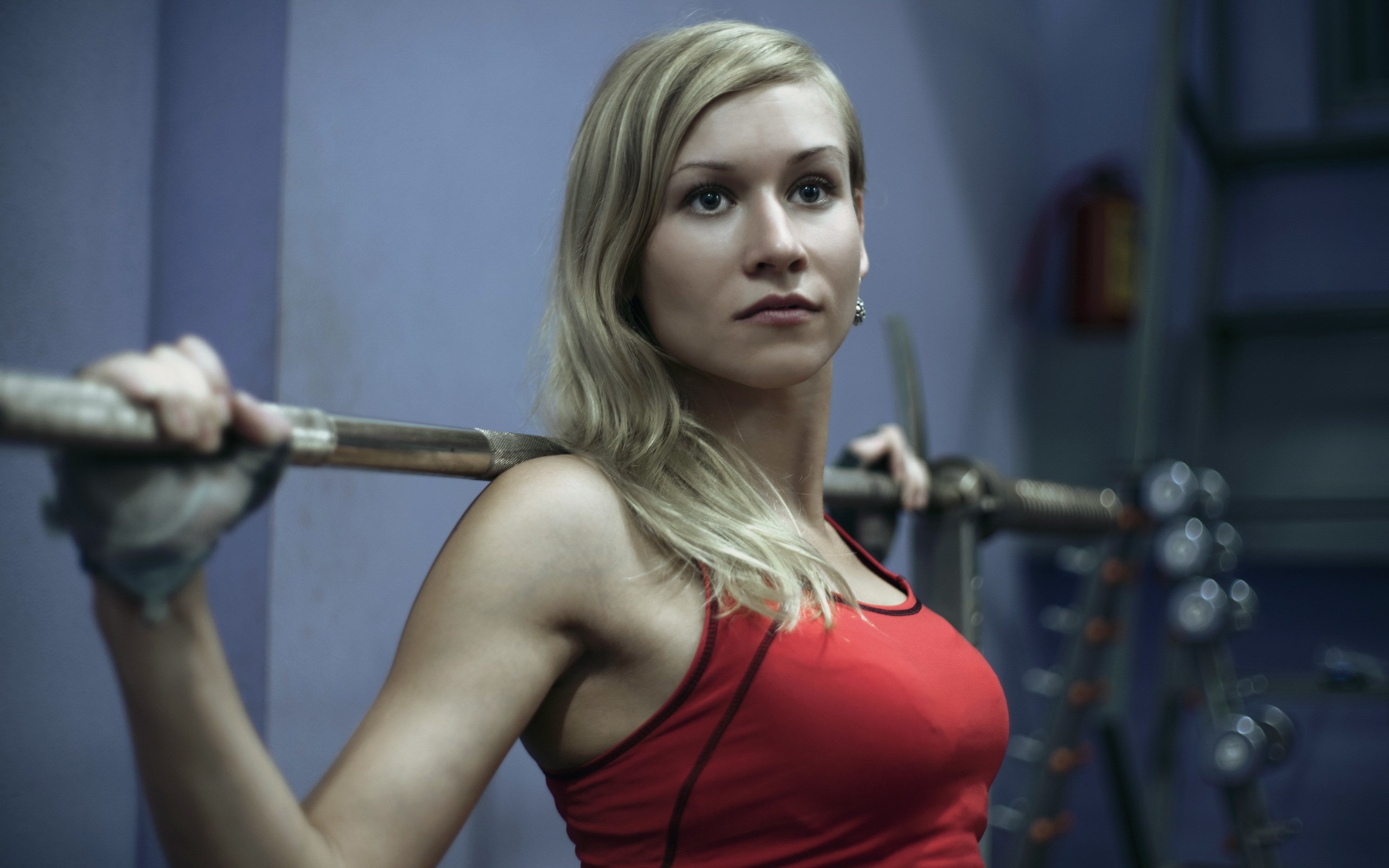 Woman in red tank top holding a barbell HD Wallpaper