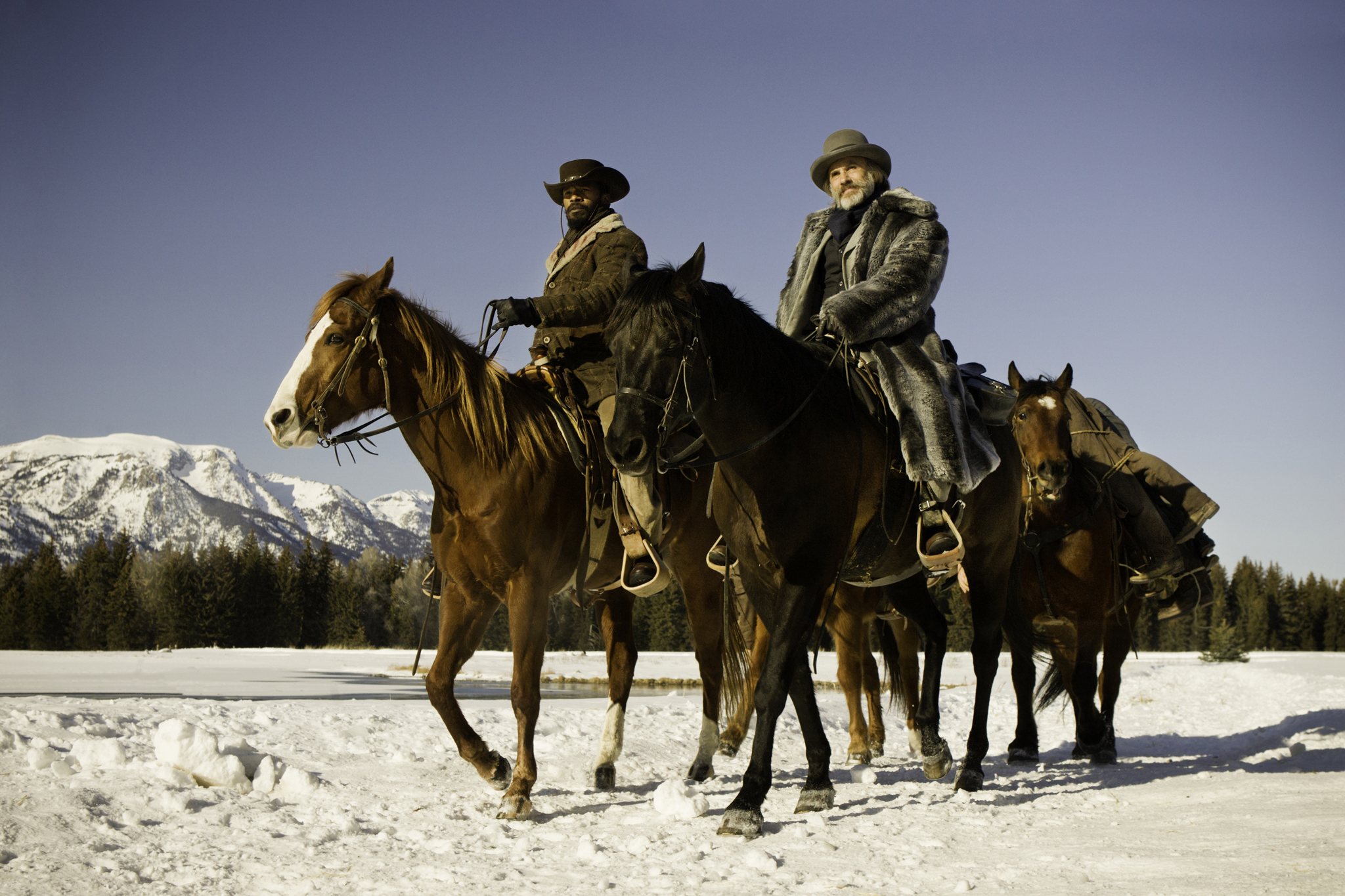 Jamie Foxx on horseback in snowy landscape HD Wallpaper