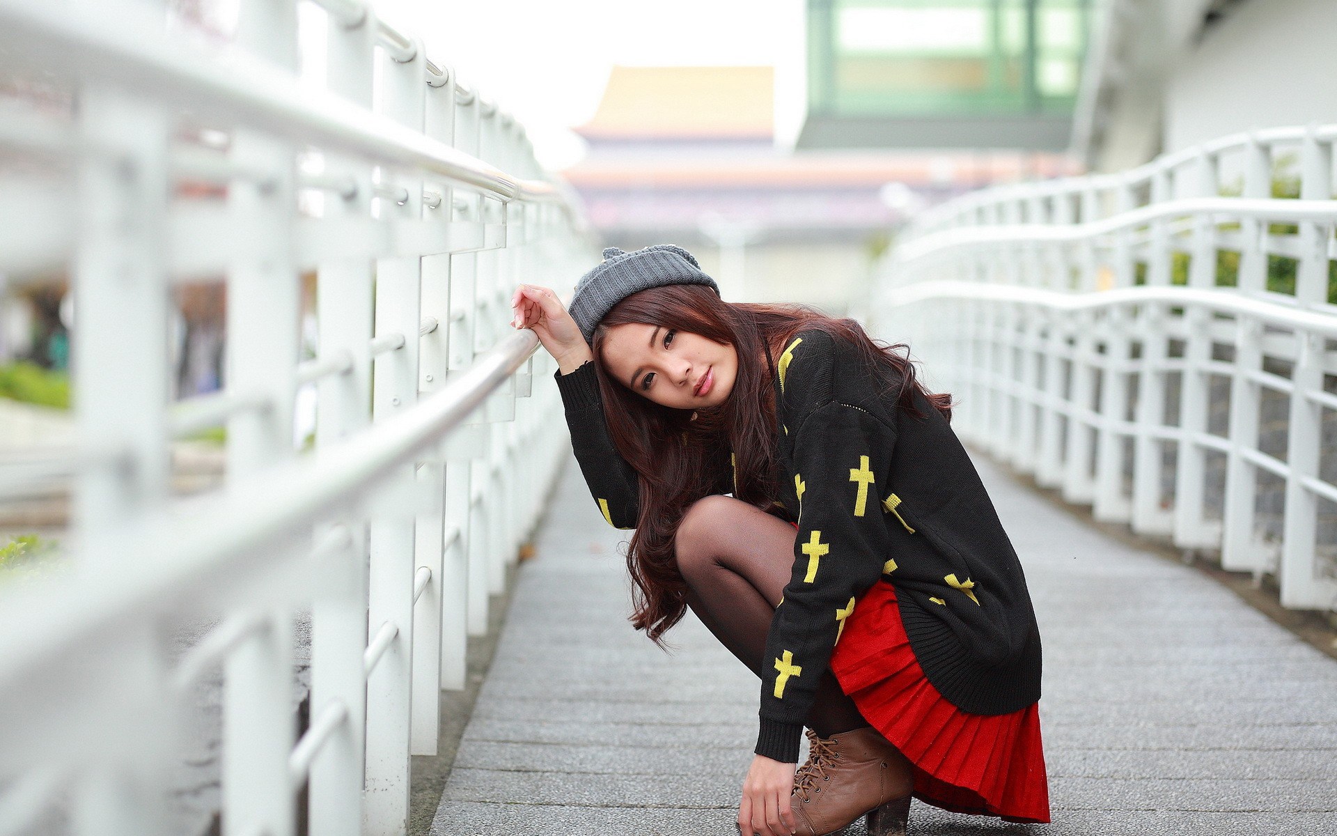 Woman in black sweater and red skirt on a bridge HD Wallpaper