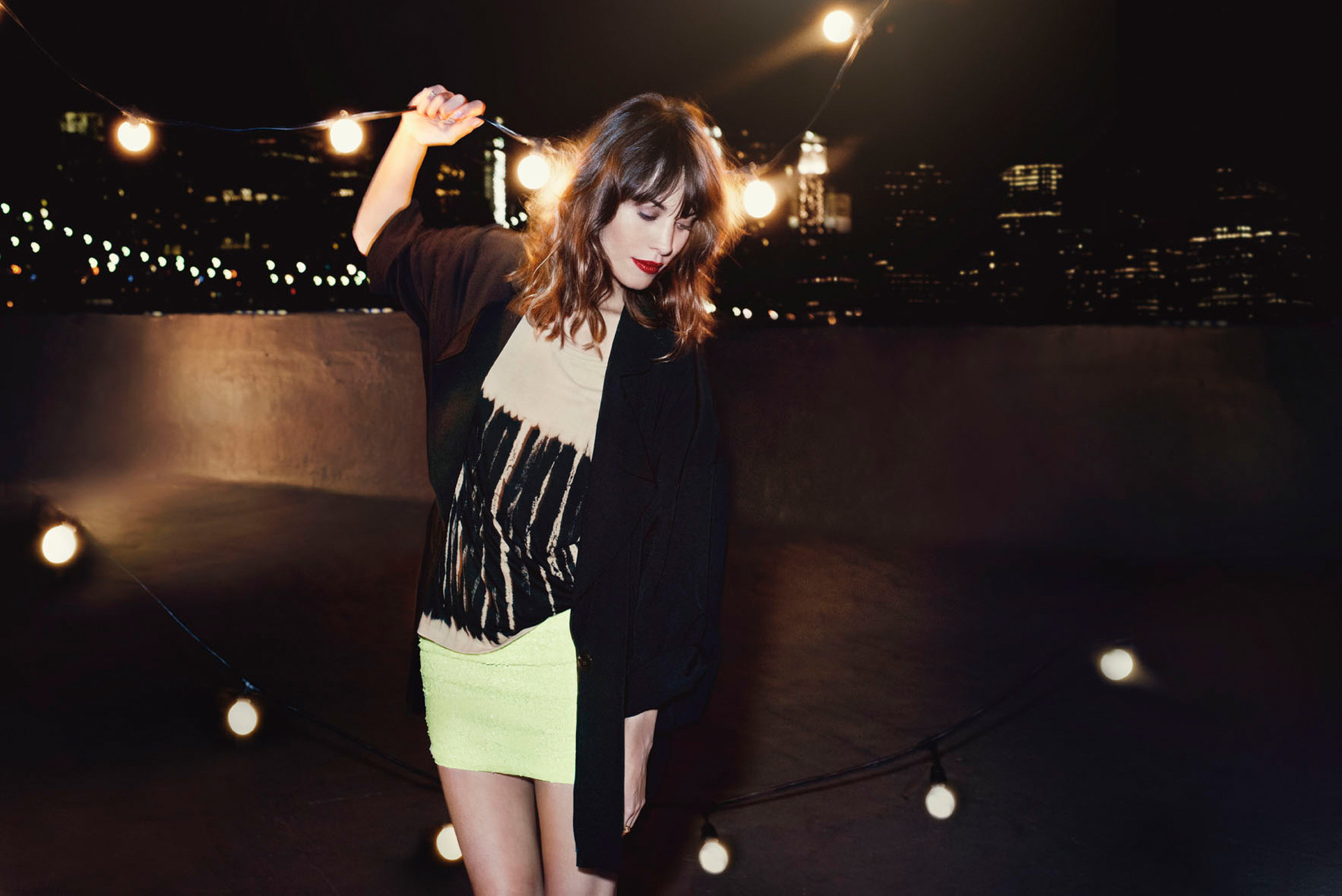 Alexa Chung on a rooftop at night HD Wallpaper