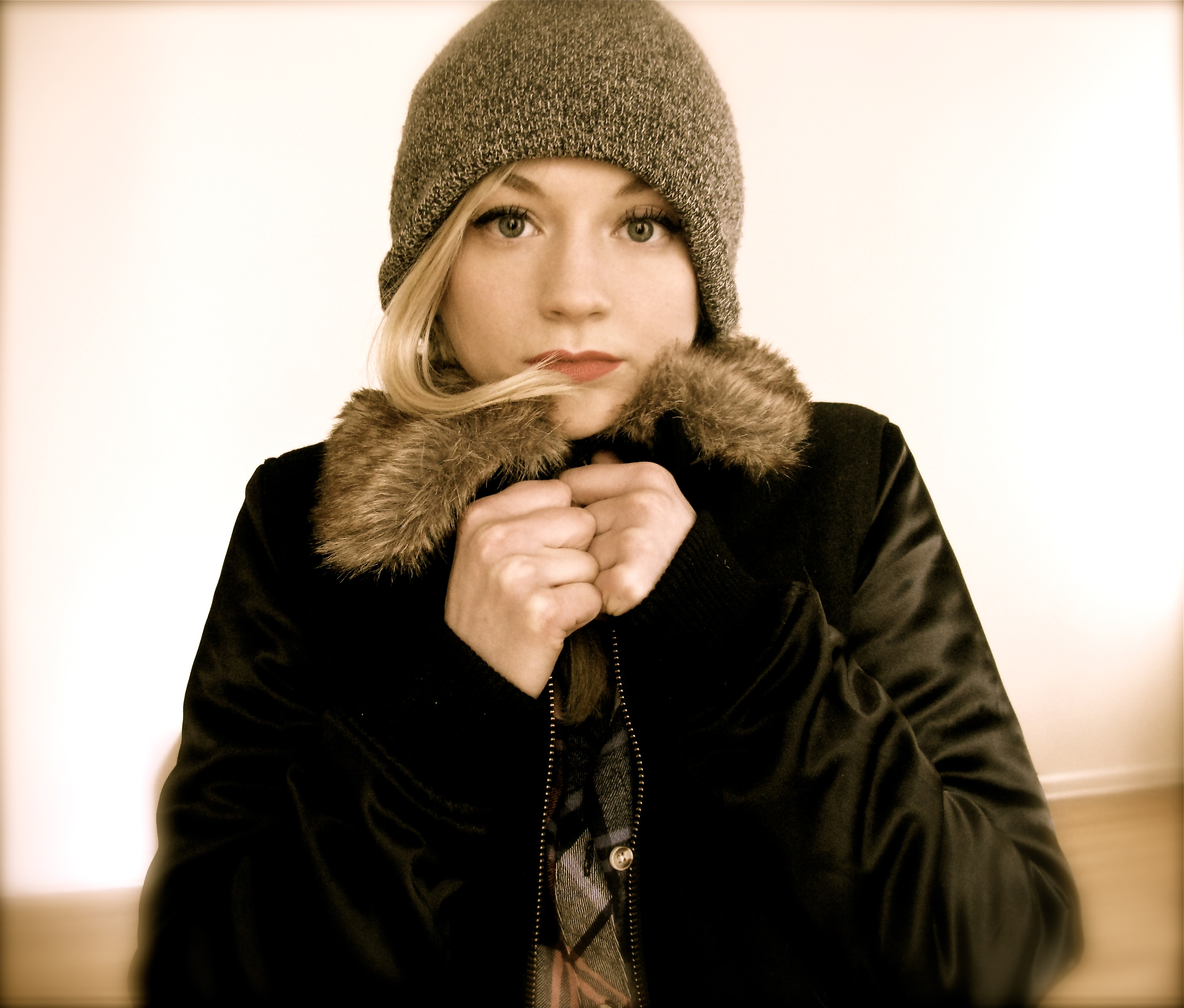 Emily Kinney wearing a beanie and fur-lined jacket HD Wallpaper