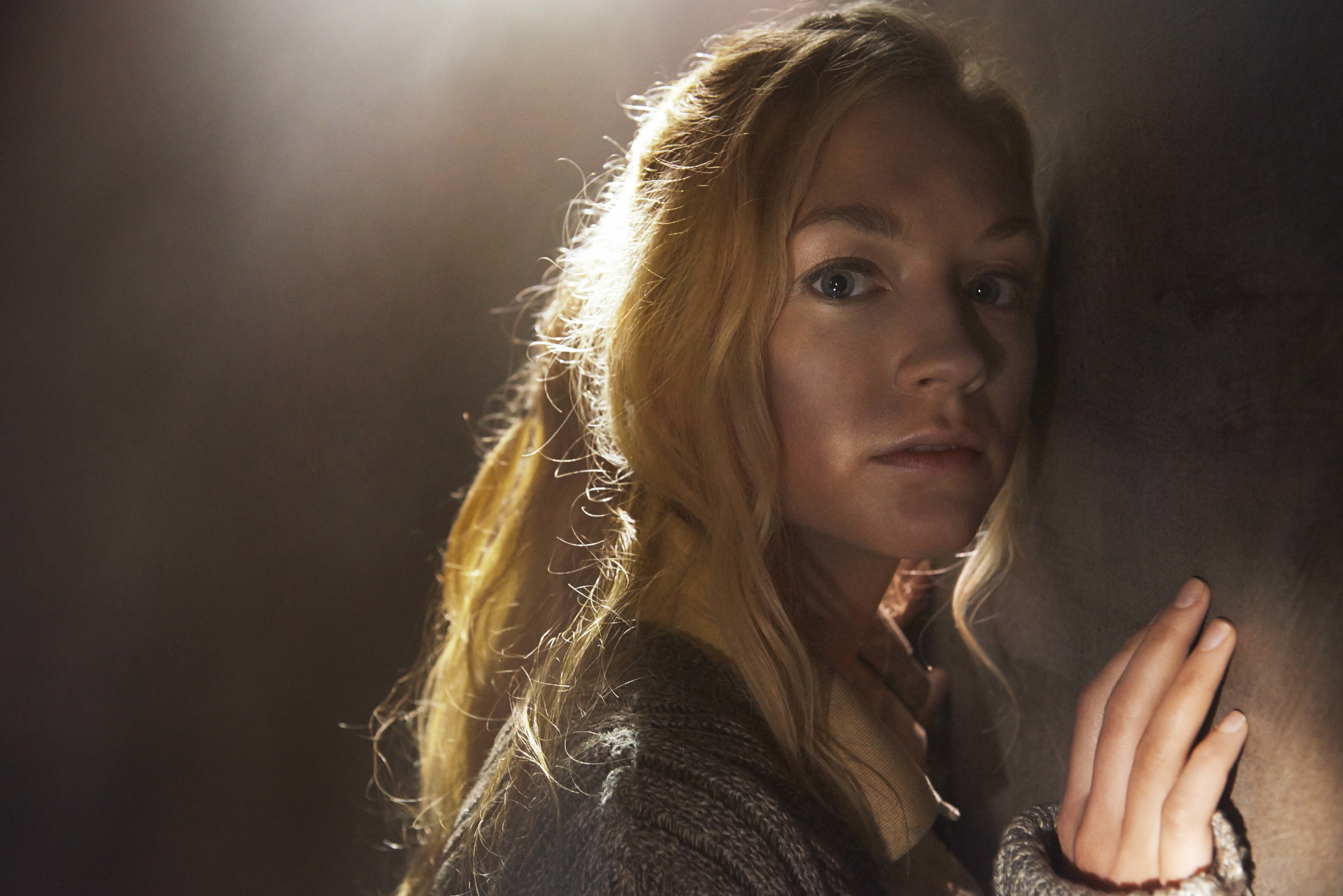 Emily Kinney leaning against a wall HD Wallpaper