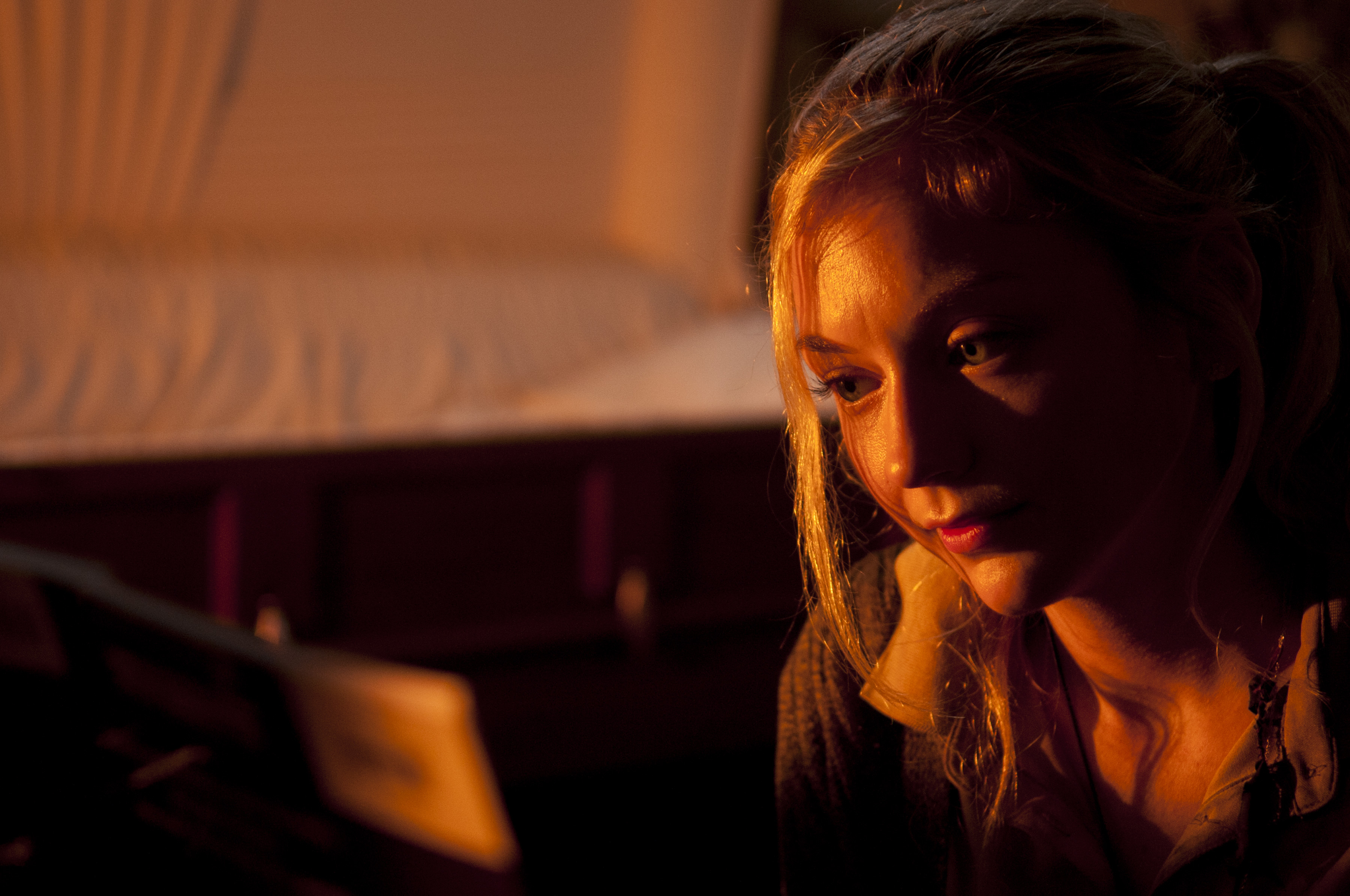 Emily Kinney in a dimly lit room with a coffin HD Wallpaper