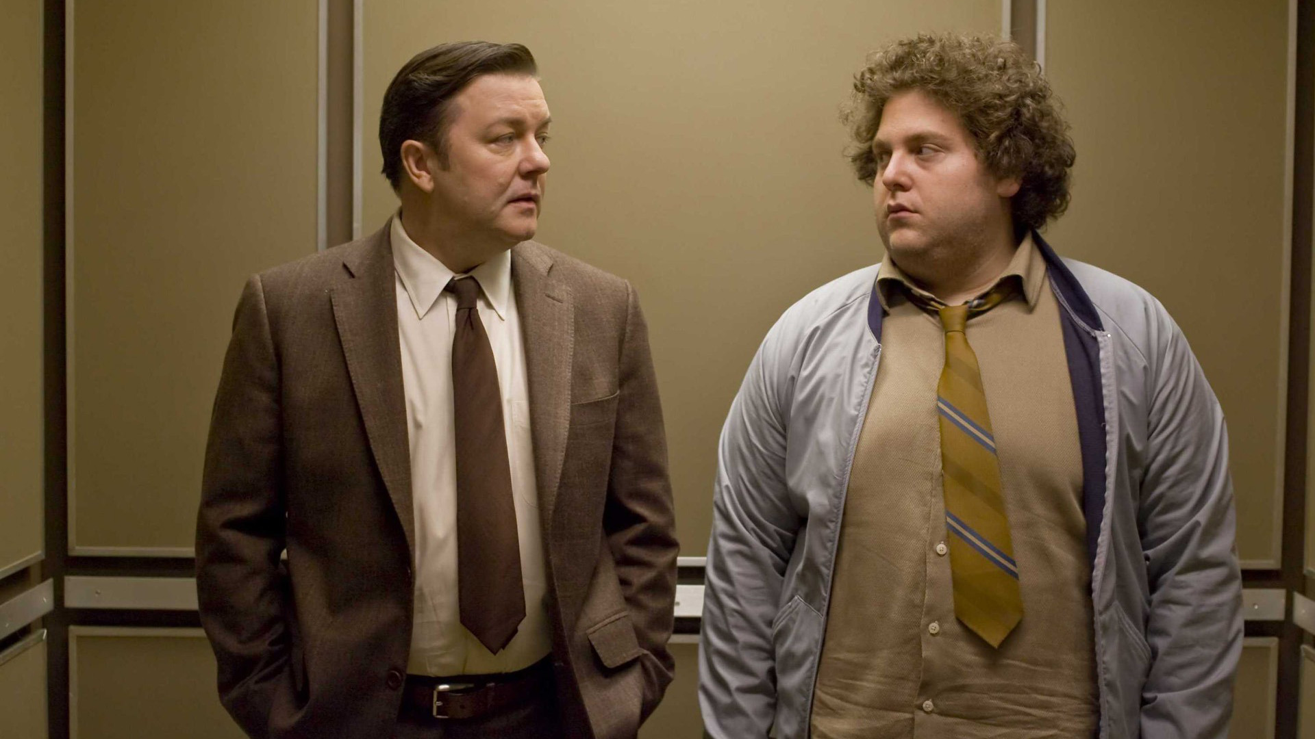 Jonah Hill and Ricky Gervais in an elevator HD Wallpaper