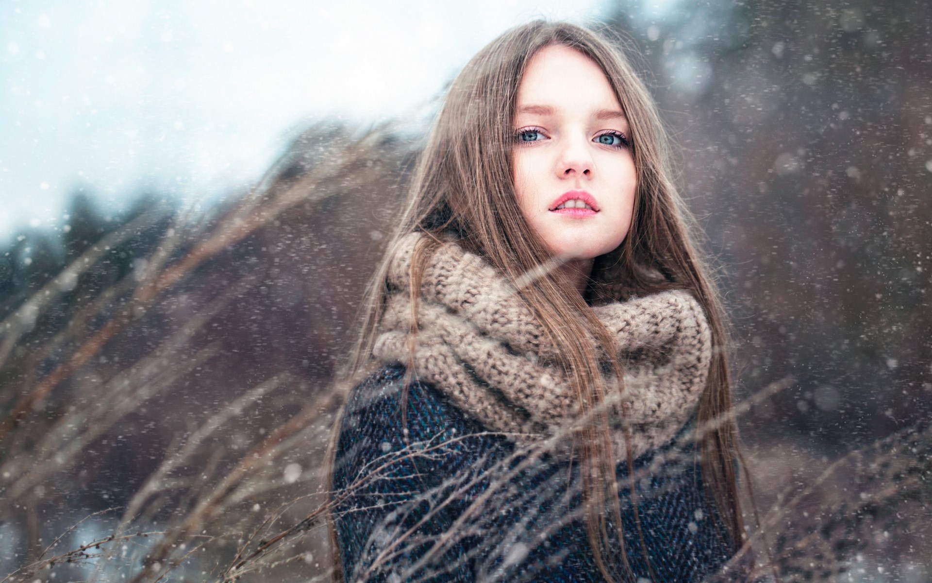 Woman in winter with snow falling HD Wallpaper