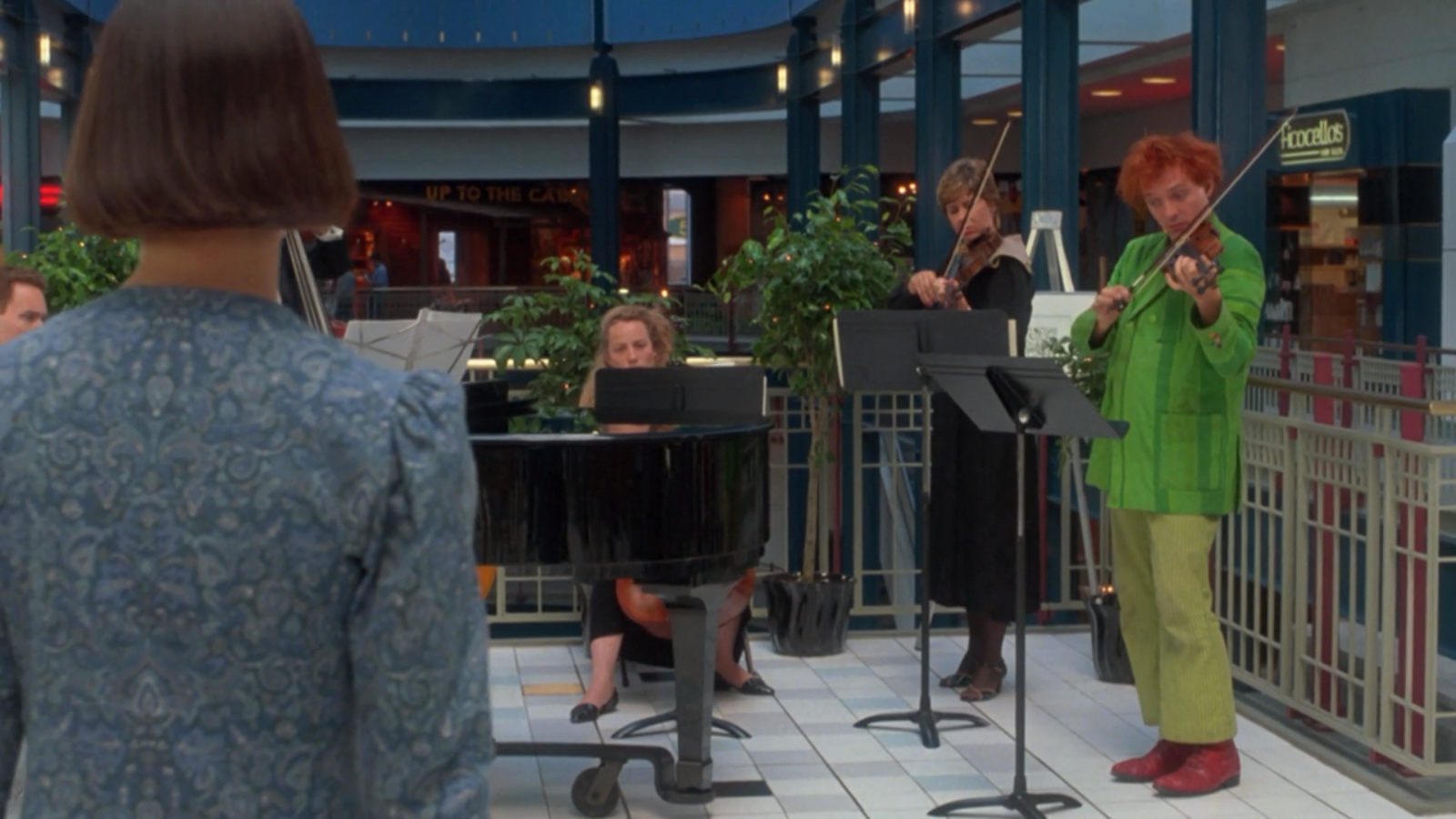 Rik Mayall playing violin in a mall HD Wallpaper