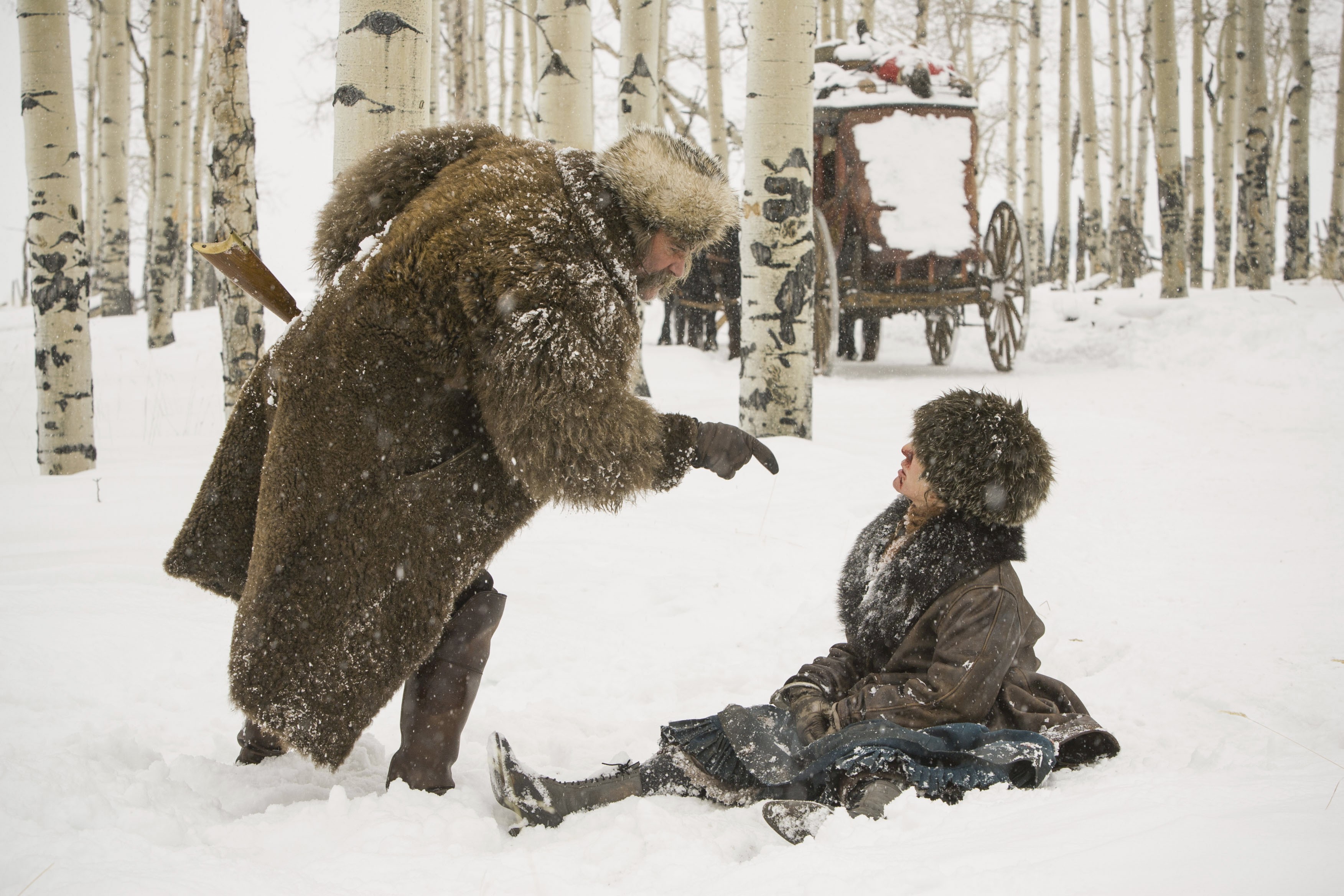 Kurt Russell in a snowy forest with a carriage HD Wallpaper