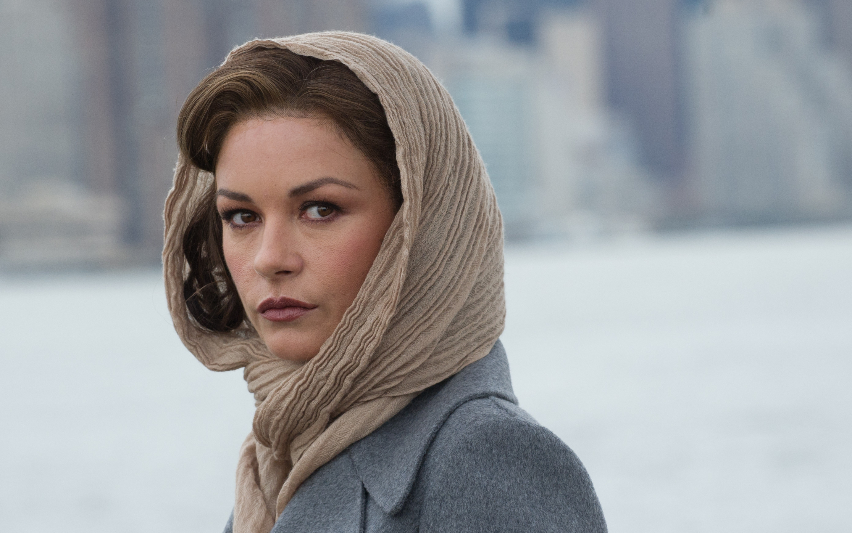 Catherine Zeta-Jones wearing a headscarf and coat HD Wallpaper