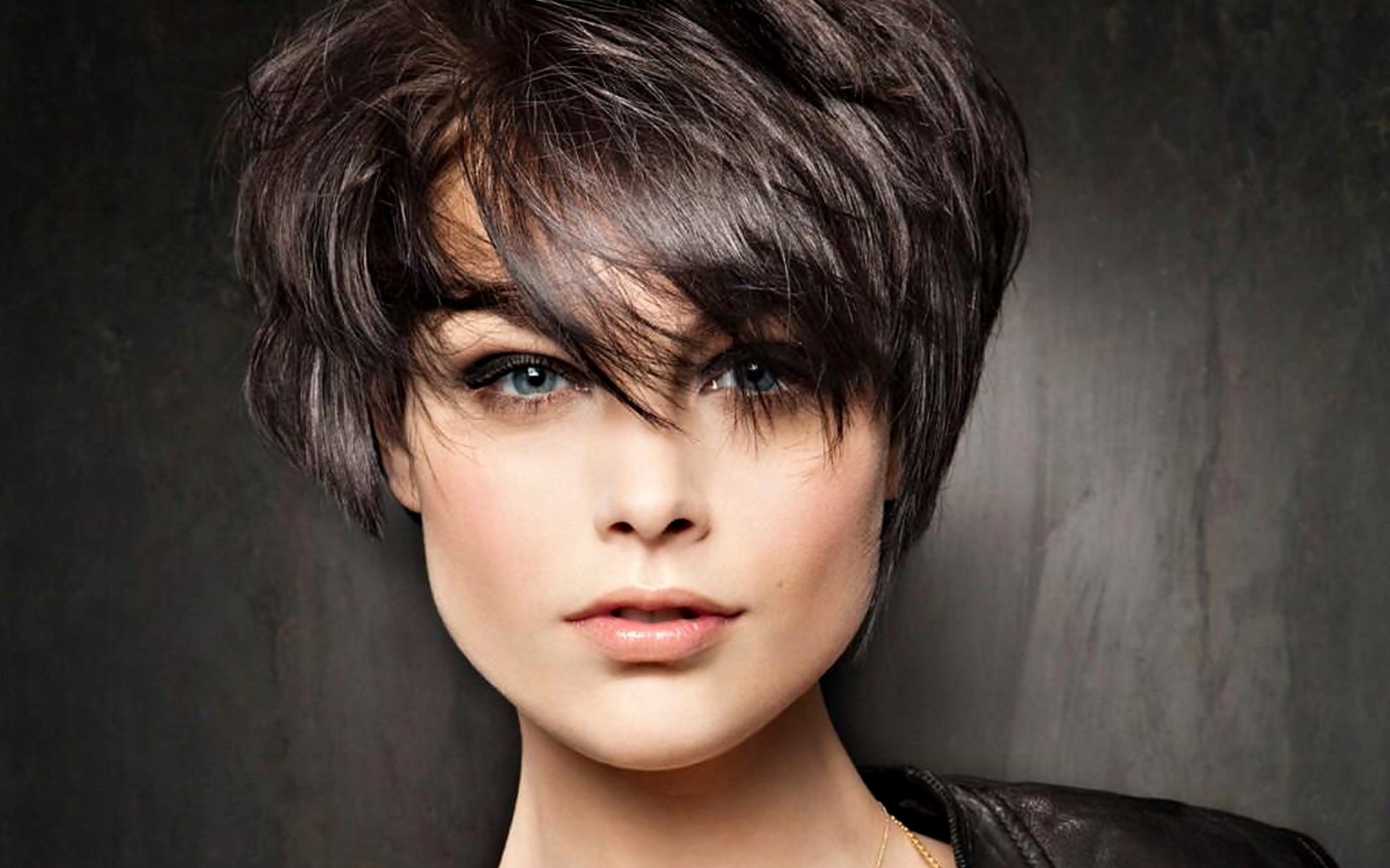 Woman with short dark hair and blue eyes HD Wallpaper