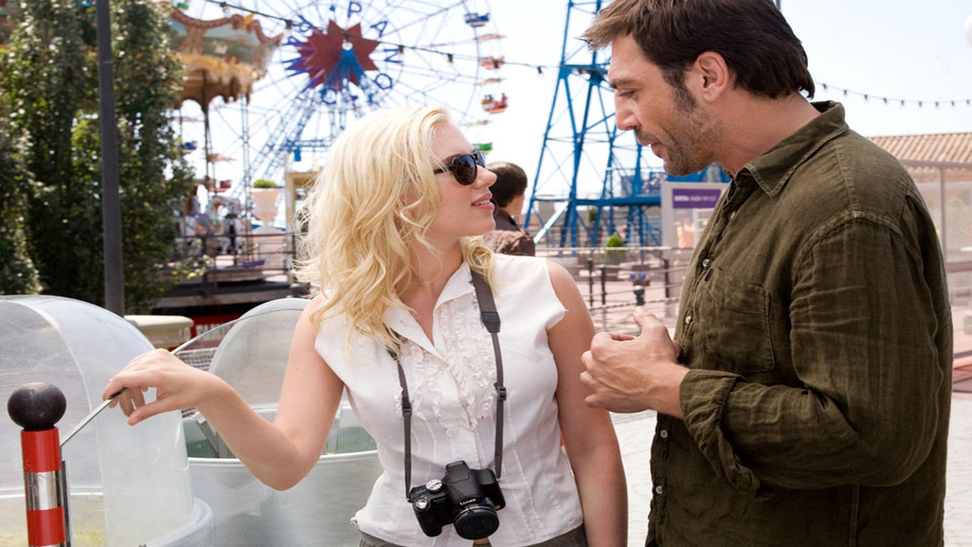 Javier Bardem and Scarlett Johansson at amusement park HD Wallpaper