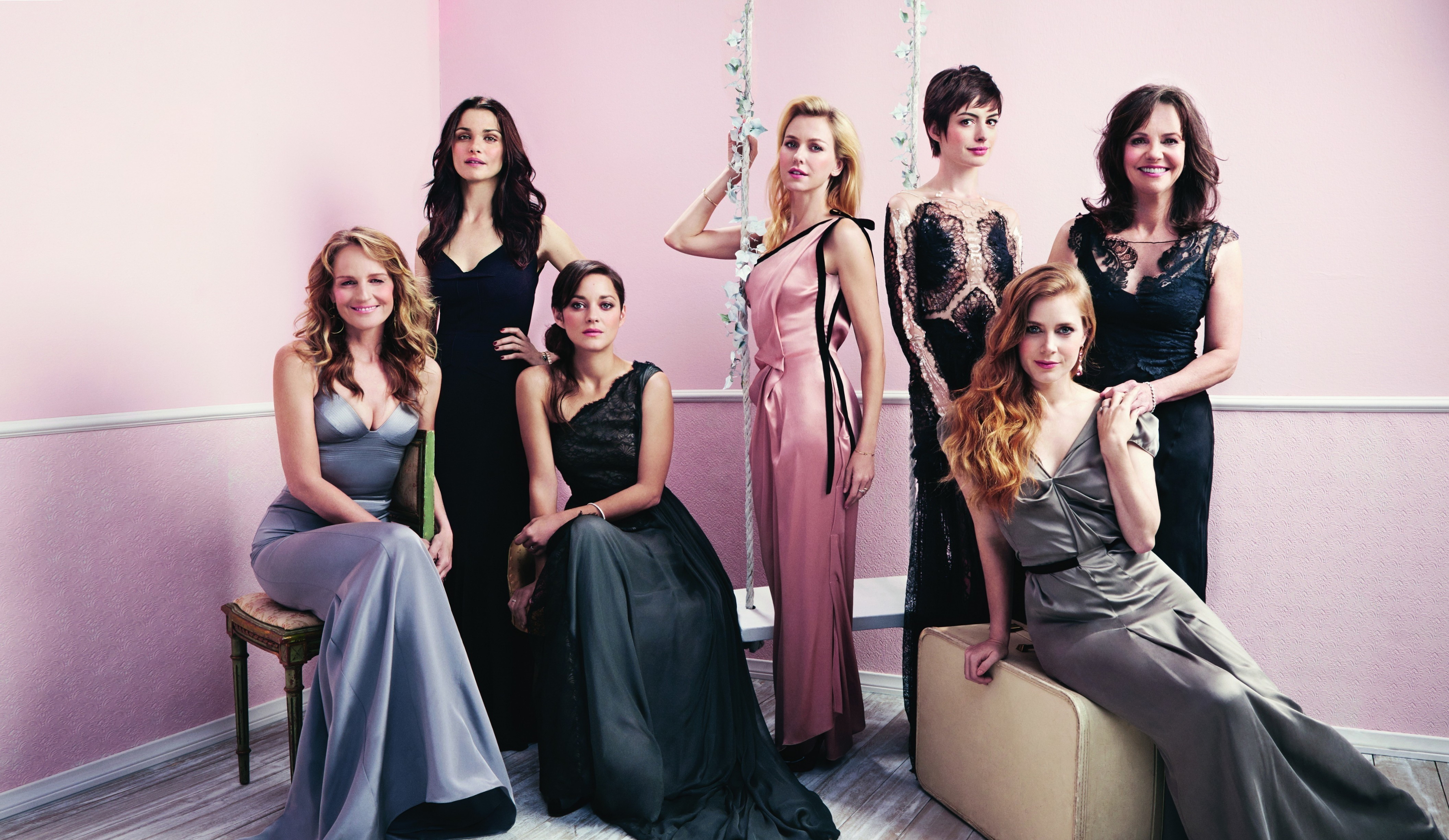 Seven women in formal gowns posing for a photo HD Wallpaper