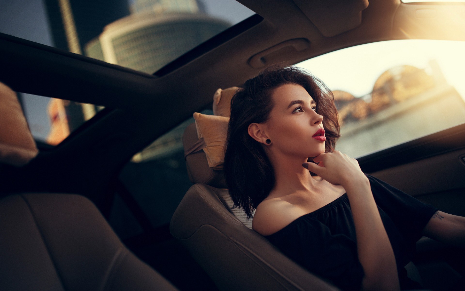 Woman in car looking out window HD Wallpaper