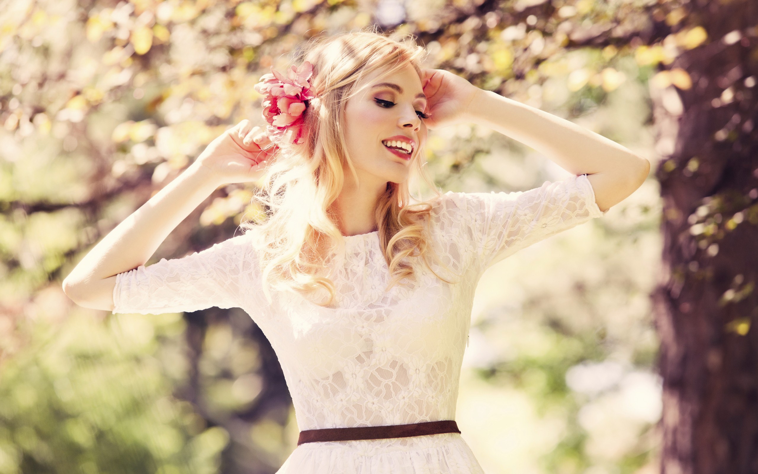 Woman with flower in hair wearing white lace dress HD Wallpaper