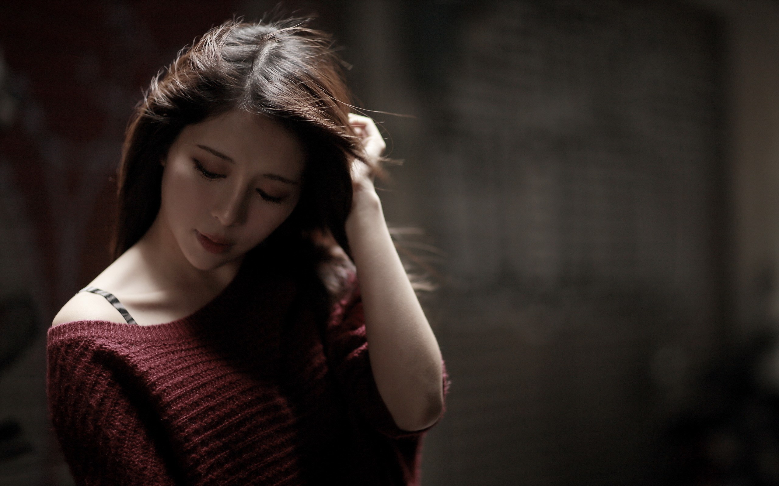 Woman with dark hair wearing a maroon sweater HD Wallpaper