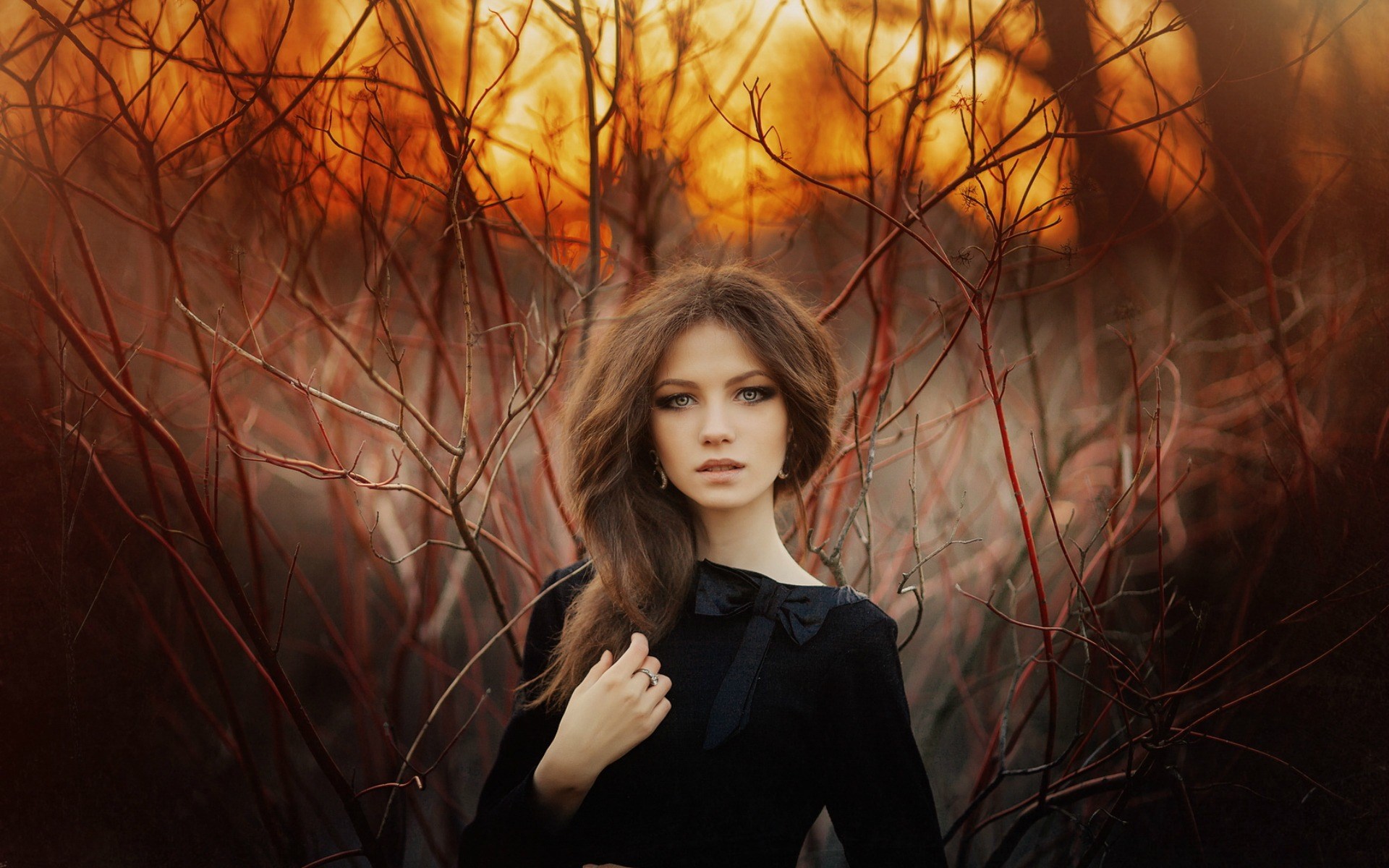 Woman in black dress among bare branches HD Wallpaper