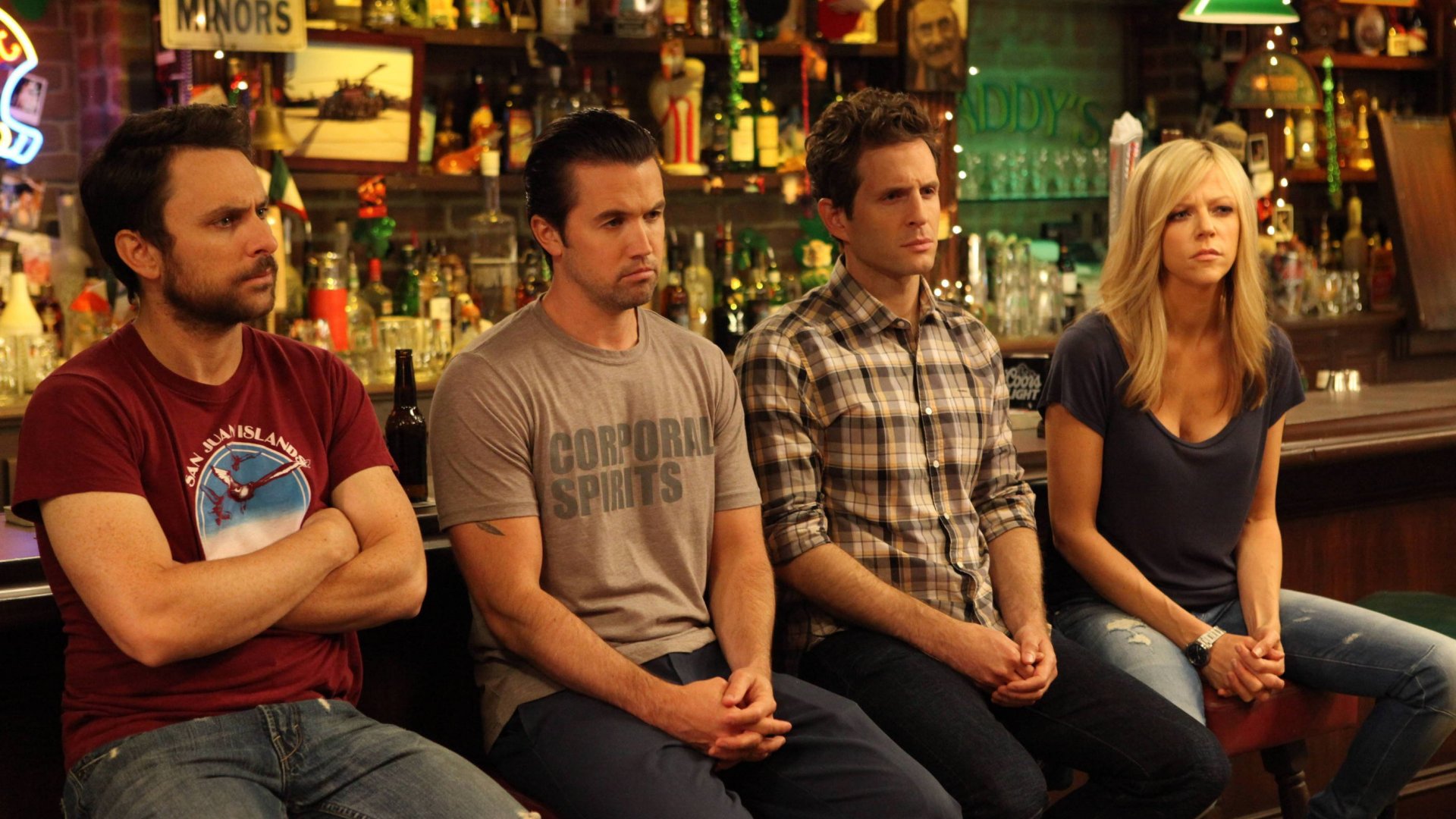 Four people sitting at a bar HD Wallpaper