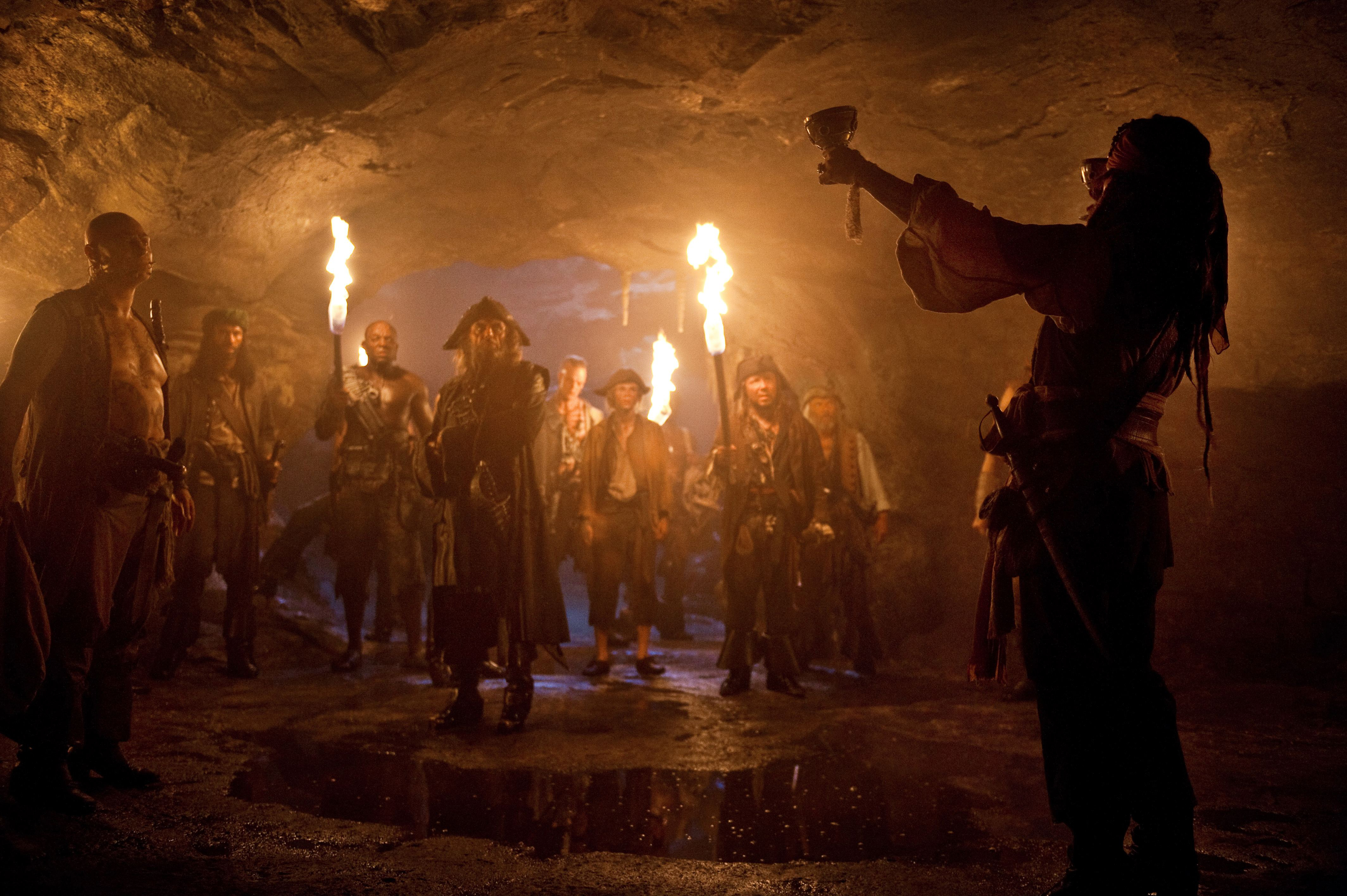 Pirates in a cave with torches HD Wallpaper