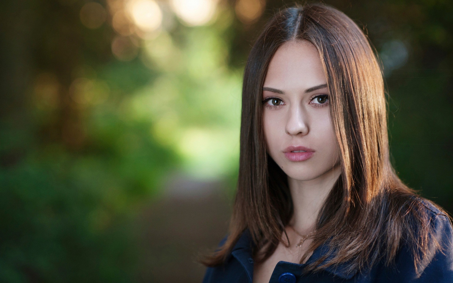 Young woman with brown hair in a blue jacket HD Wallpaper