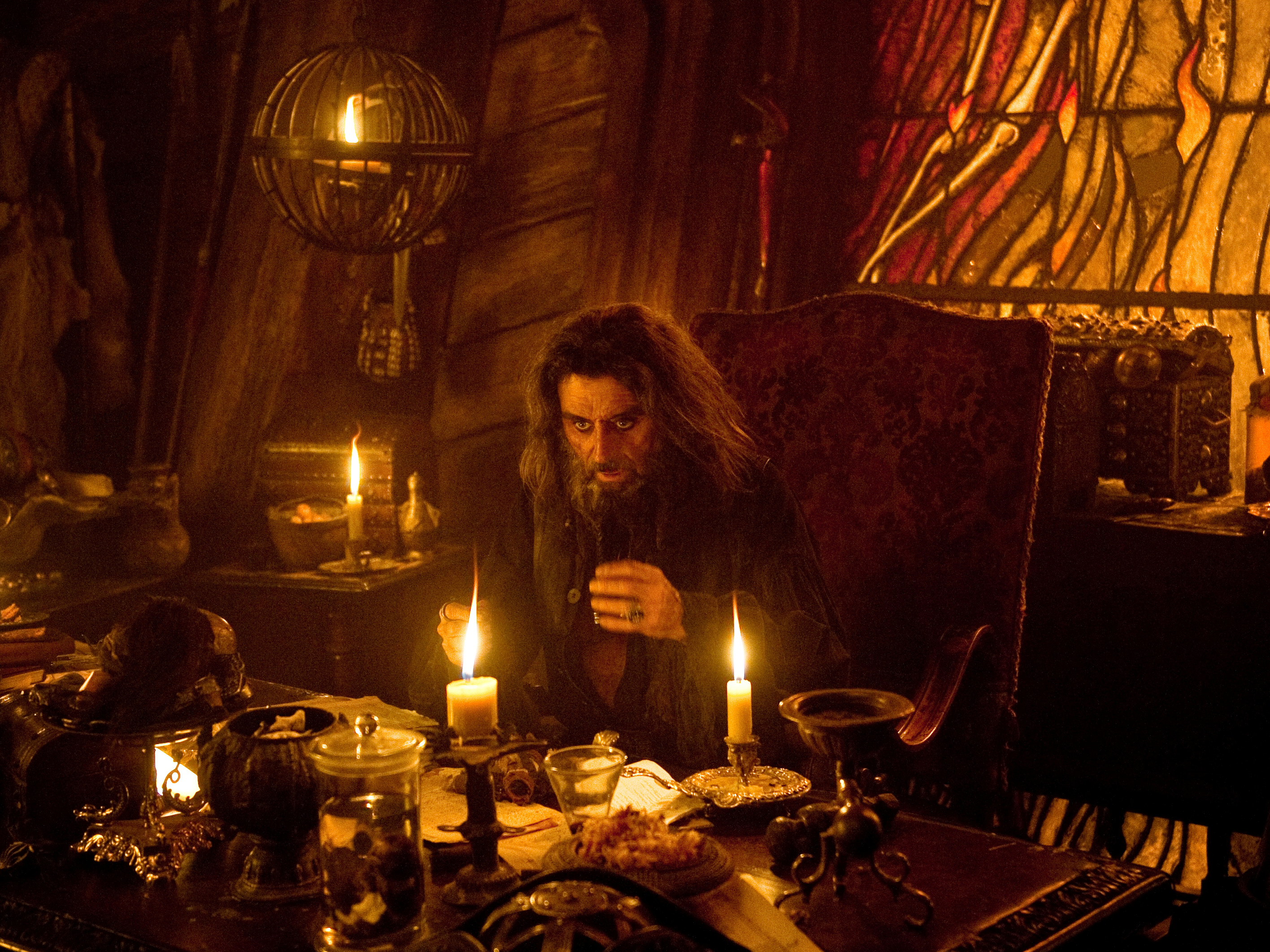Ian McShane in a dimly lit room HD Wallpaper
