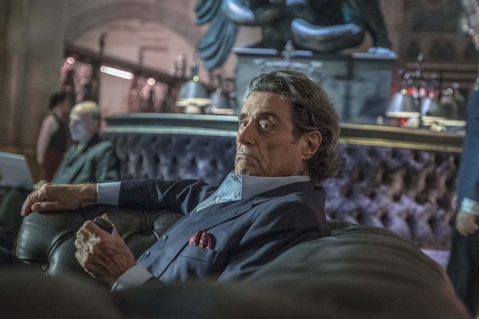 Ian McShane sitting on a couch HD Wallpaper
