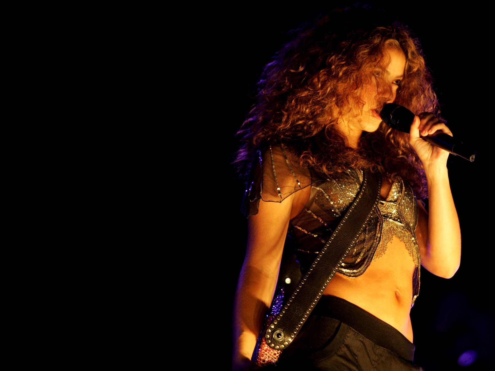 Shakira performing on stage HD Wallpaper