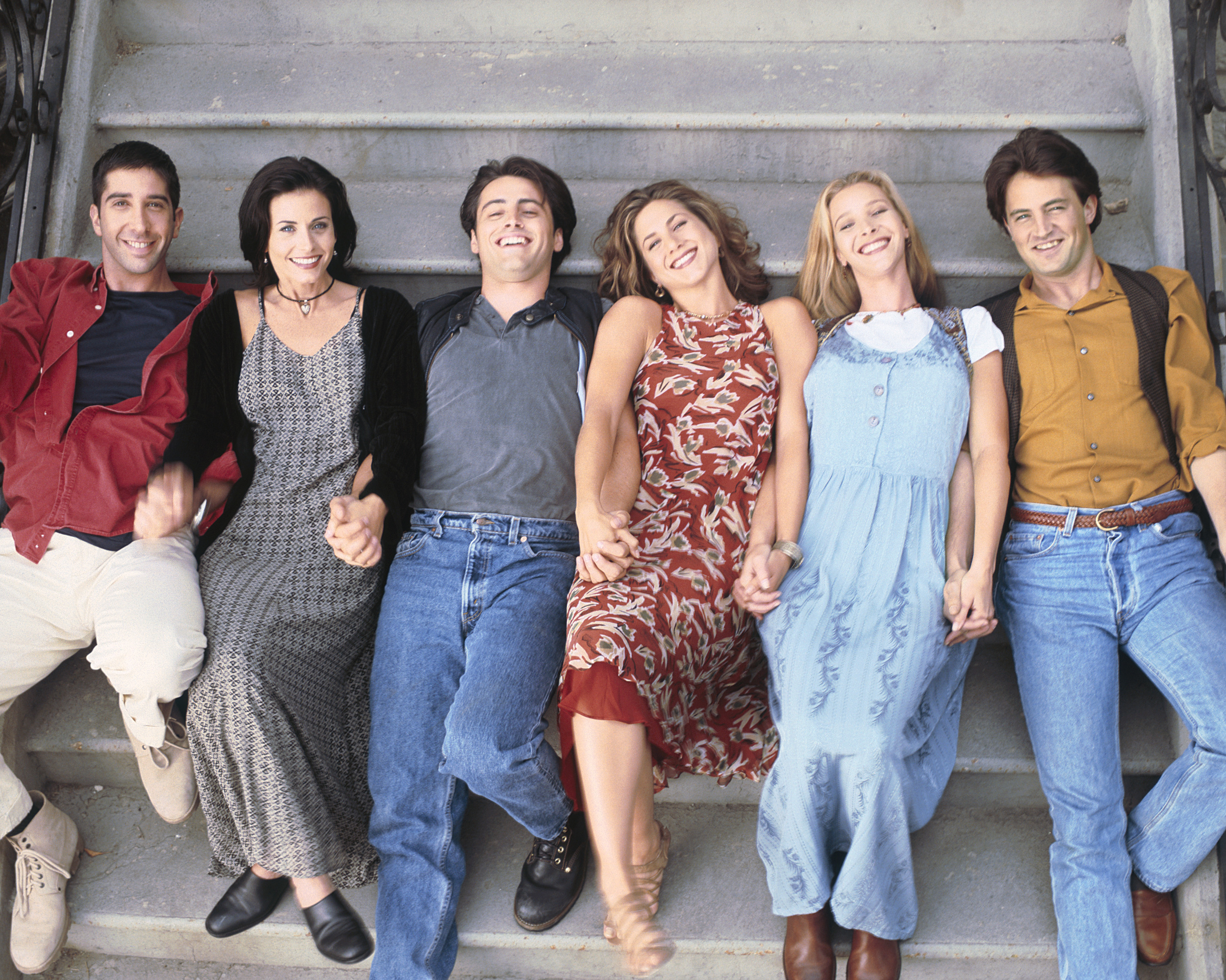 The cast of Friends sitting on stairs HD Wallpaper
