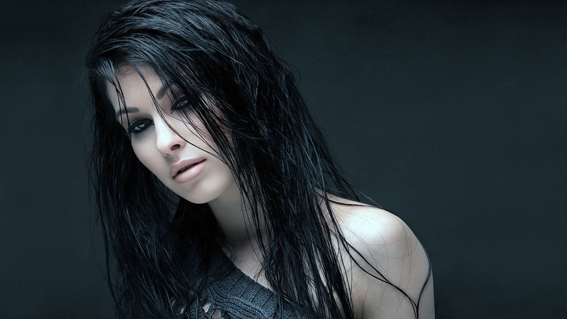 Woman with wet black hair and dark clothing HD Wallpaper