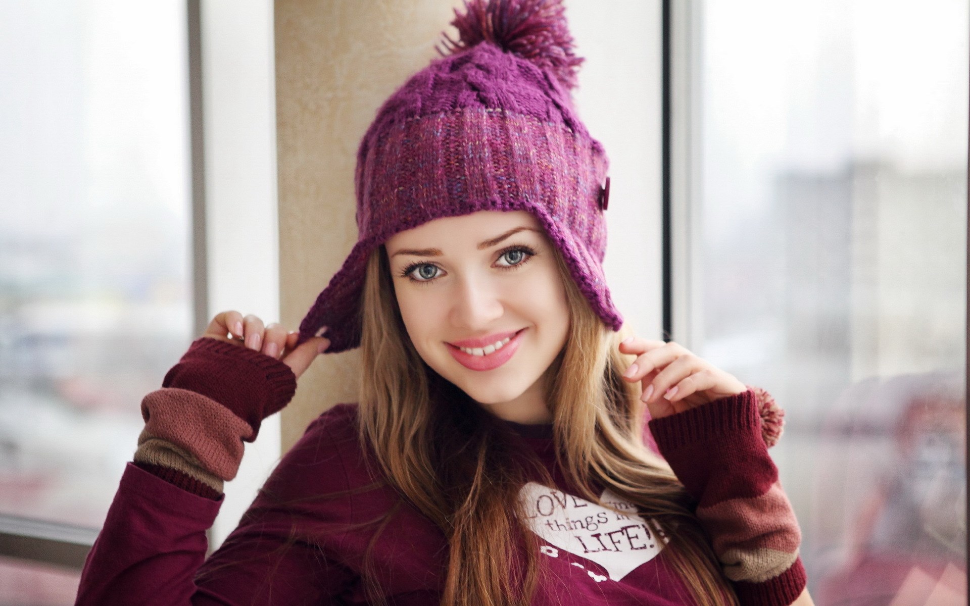 Young woman wearing a purple knitted hat and sweater HD Wallpaper