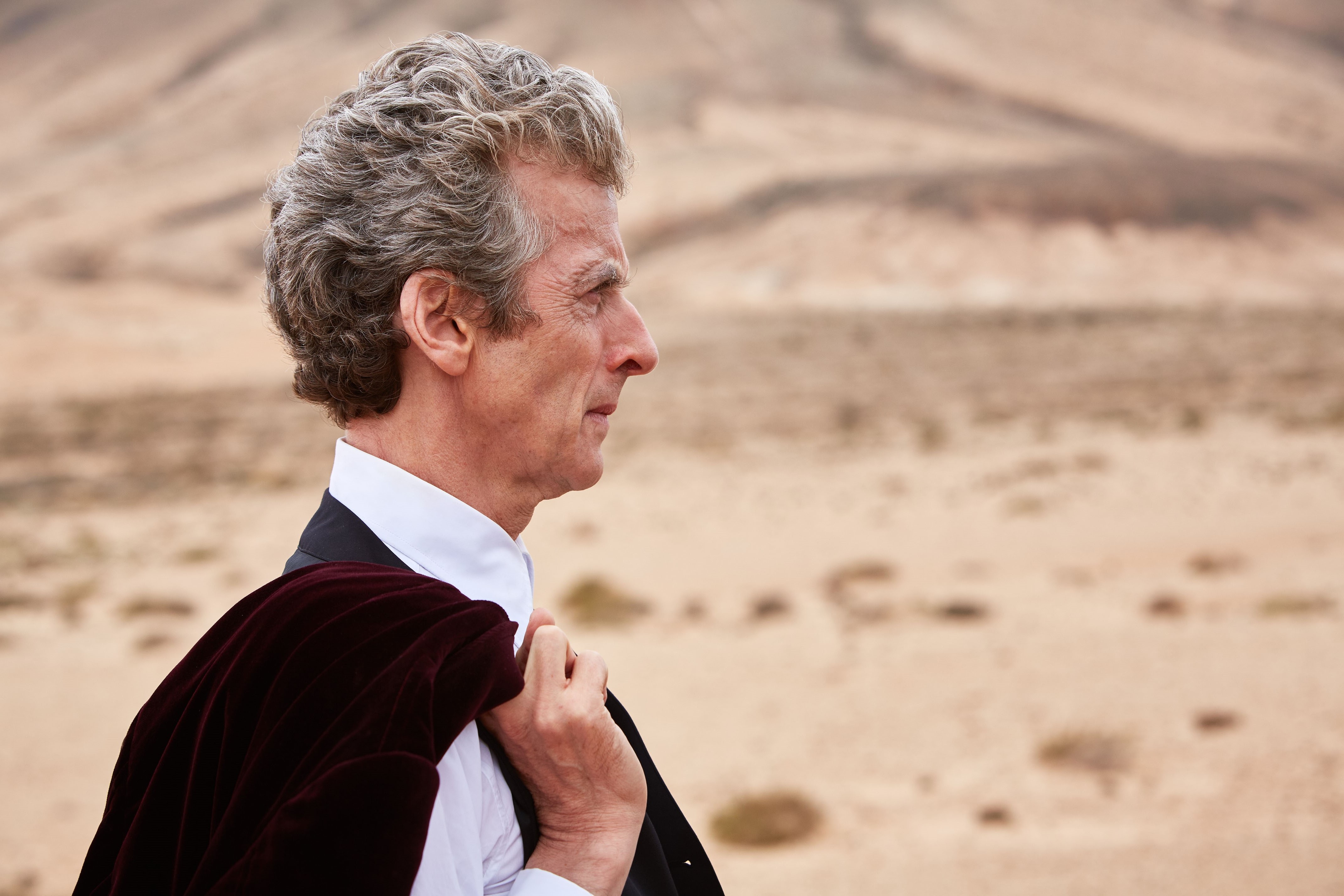 Peter Capaldi in a desert landscape HD Wallpaper
