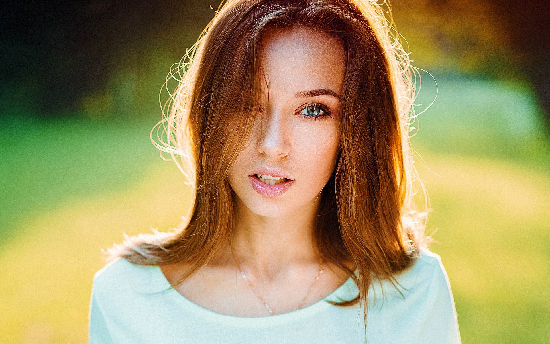 Woman with auburn hair in a light blue shirt HD Wallpaper