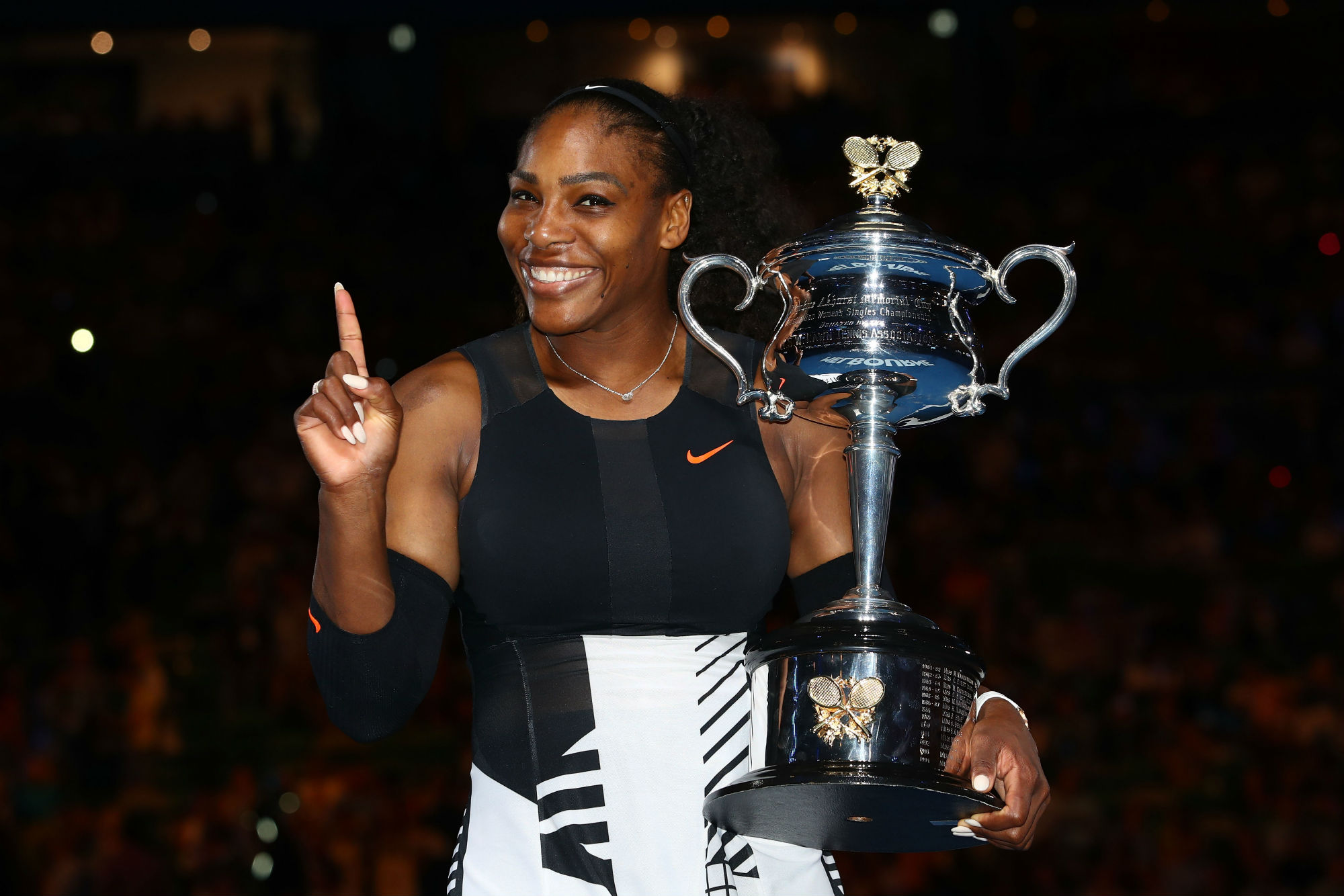 Serena Williams holding Australian Open trophy HD Wallpaper