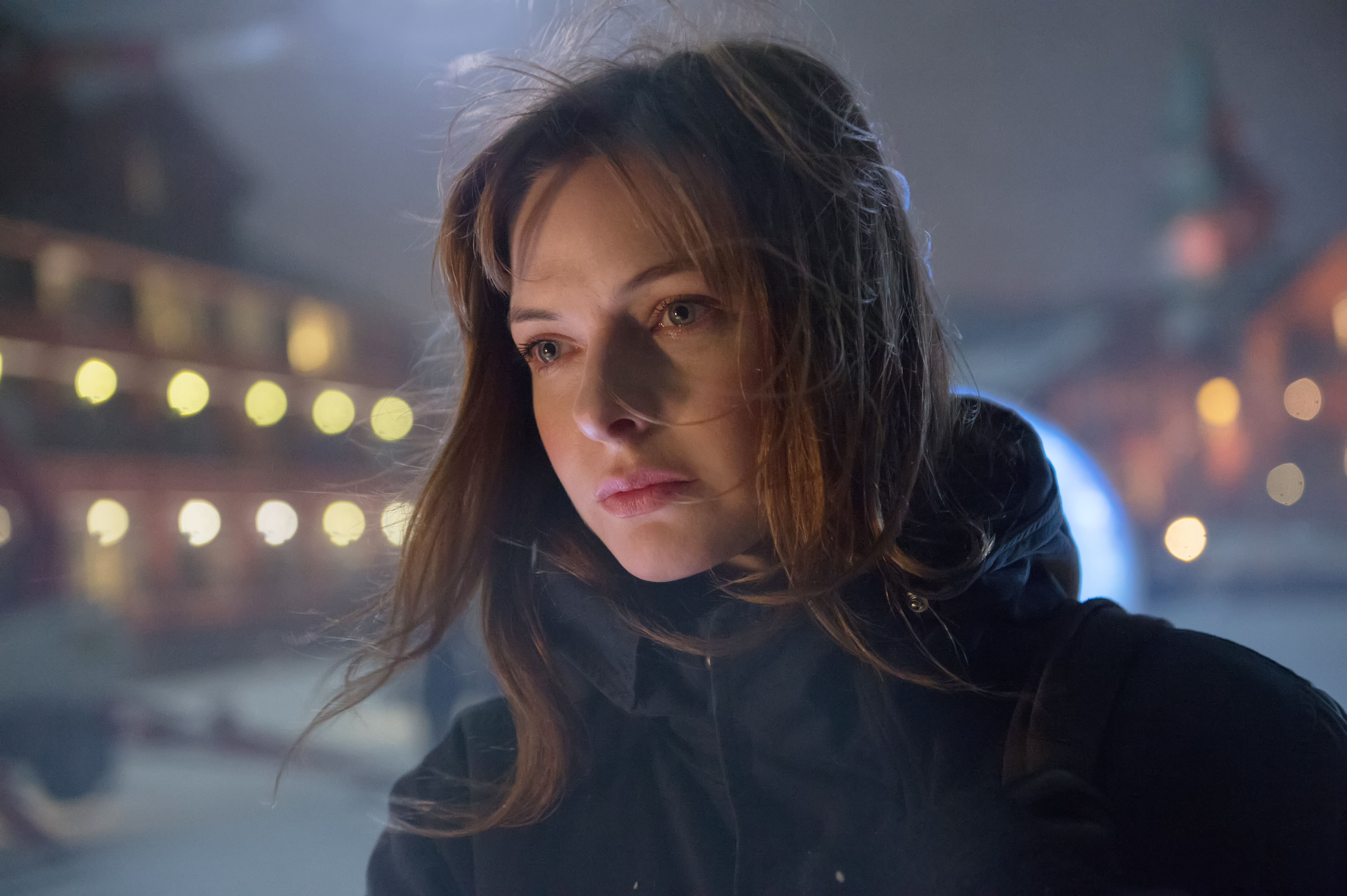 Rebecca Ferguson in a dark jacket at night HD Wallpaper