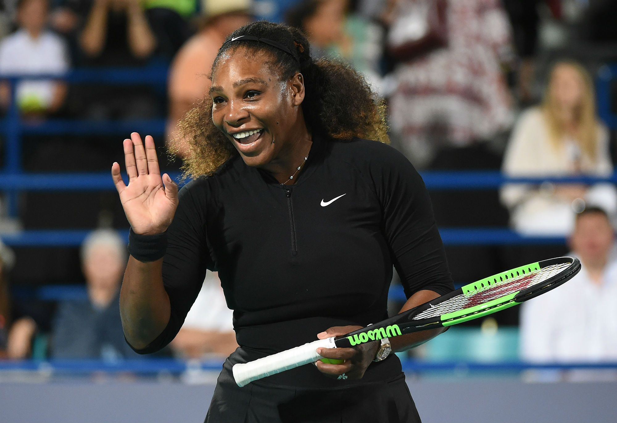 Serena Williams holding a tennis racket HD Wallpaper