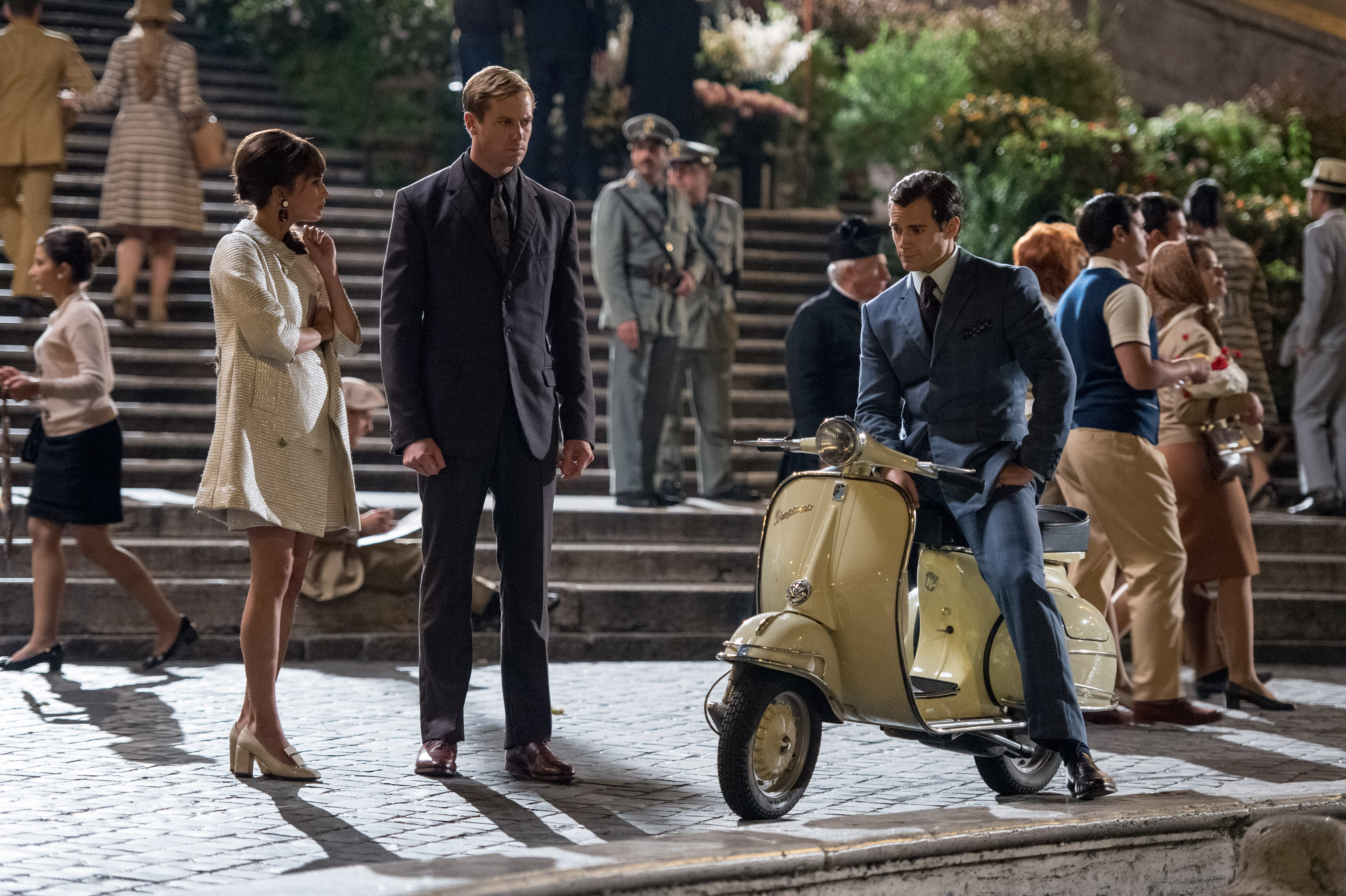 Armie Hammer in a suit on a scooter HD Wallpaper