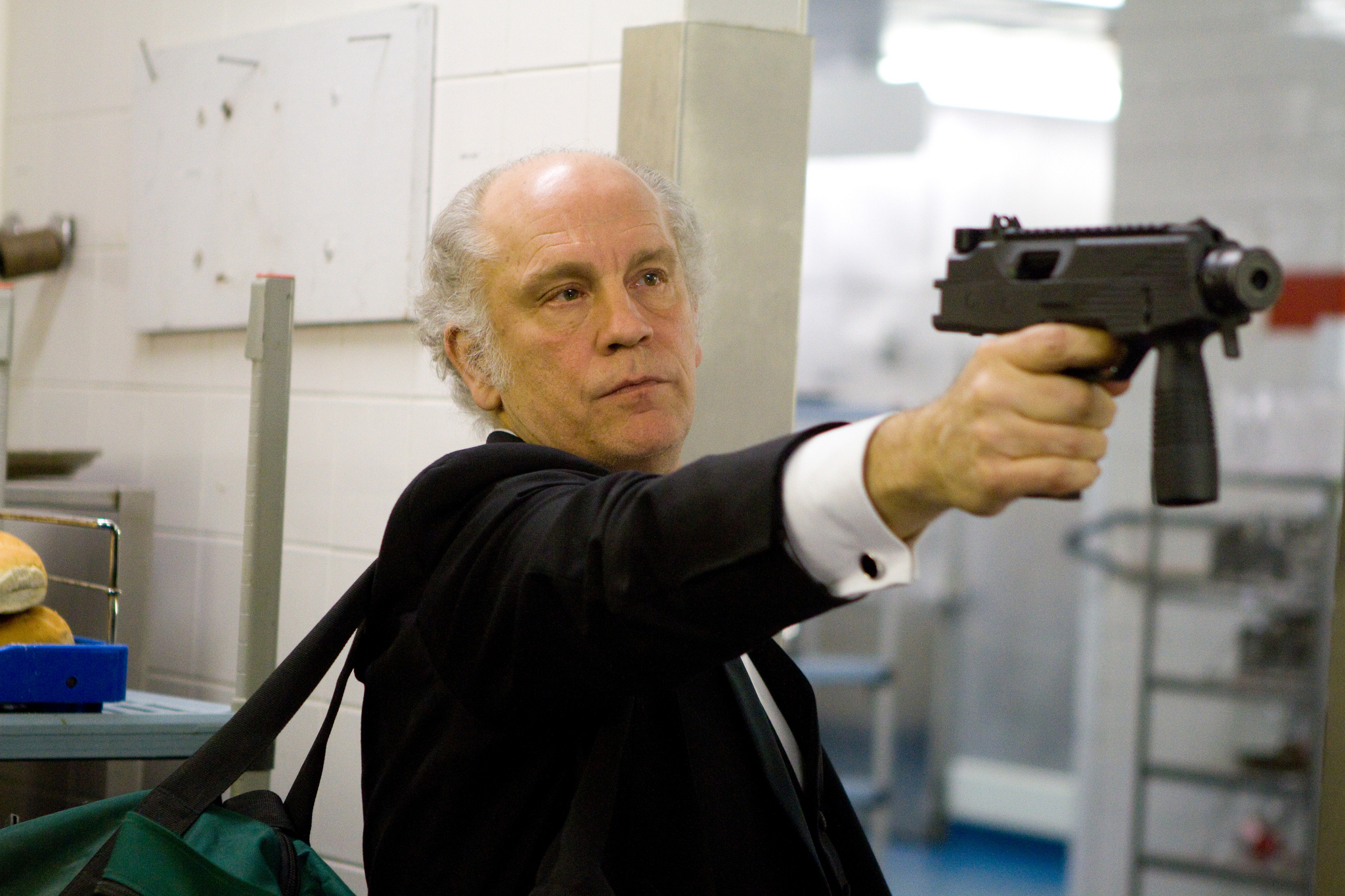John Malkovich holding a gun HD Wallpaper