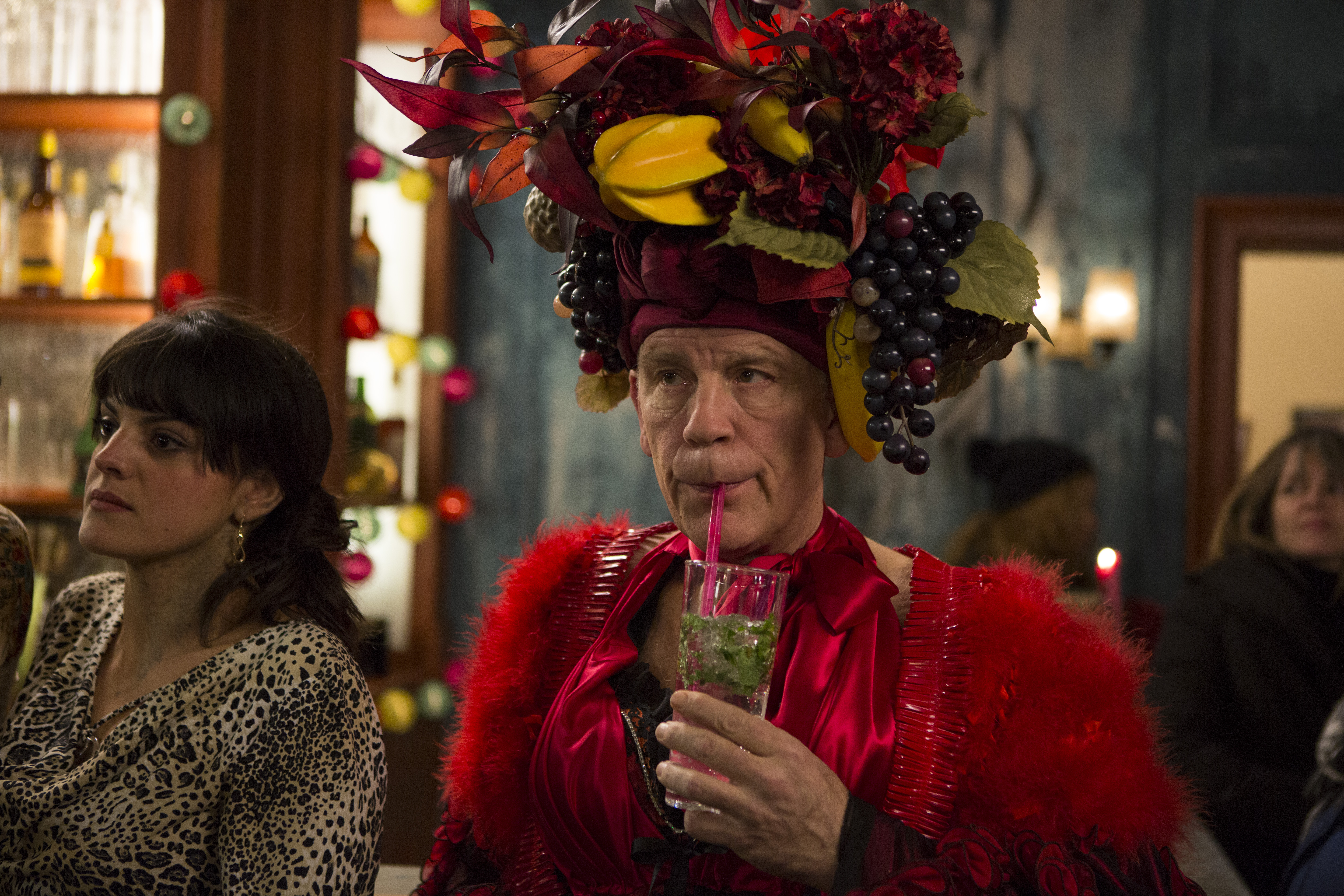 John Malkovich in costume drinking a cocktail HD Wallpaper