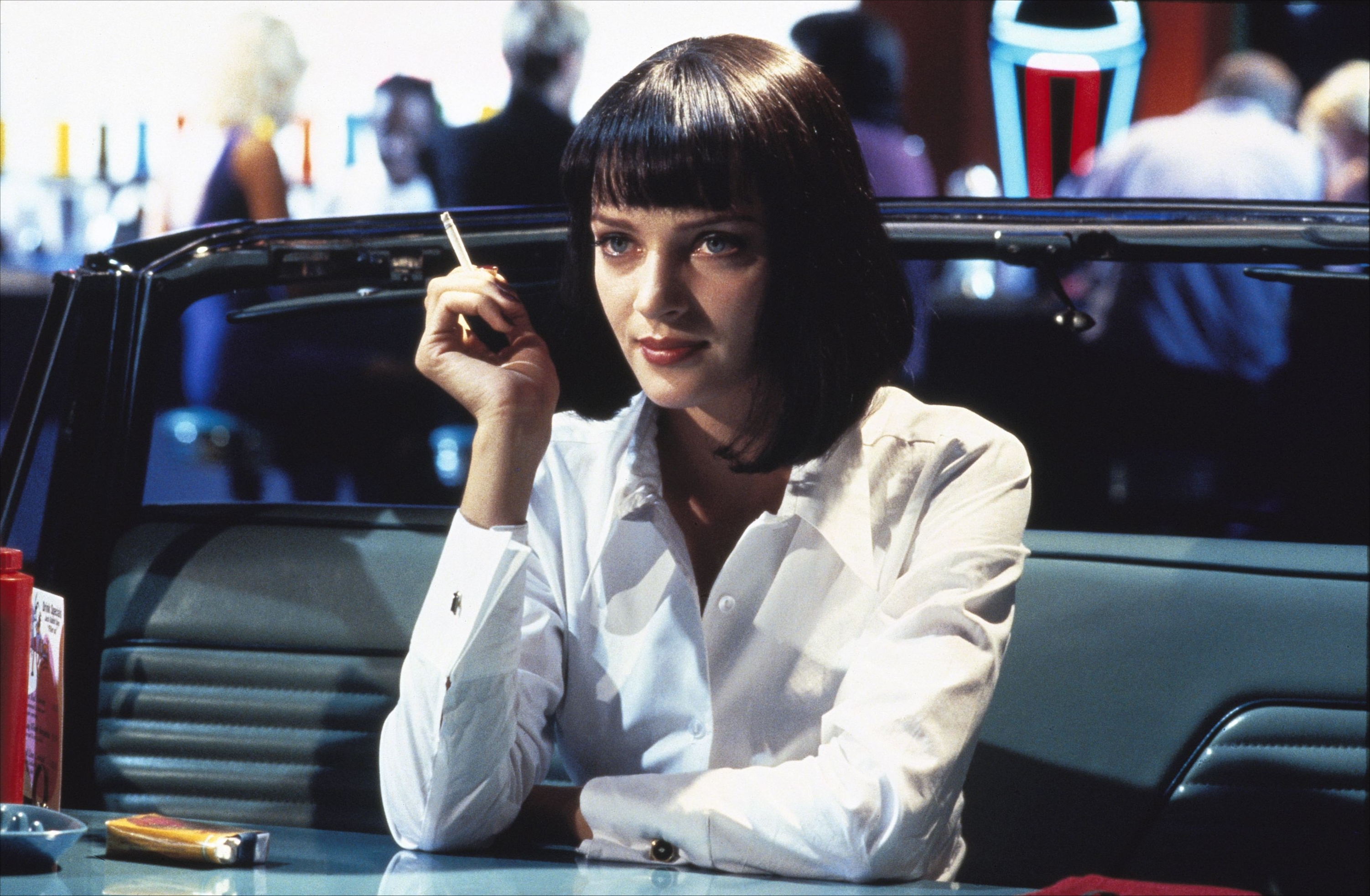 Uma Thurman smoking in a diner HD Wallpaper