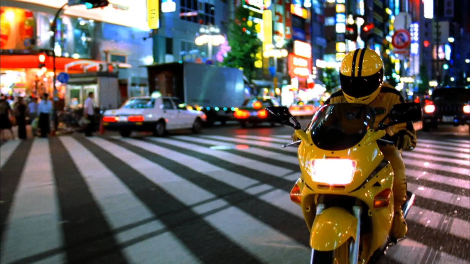 Uma Thurman on a yellow motorcycle in Tokyo HD Wallpaper