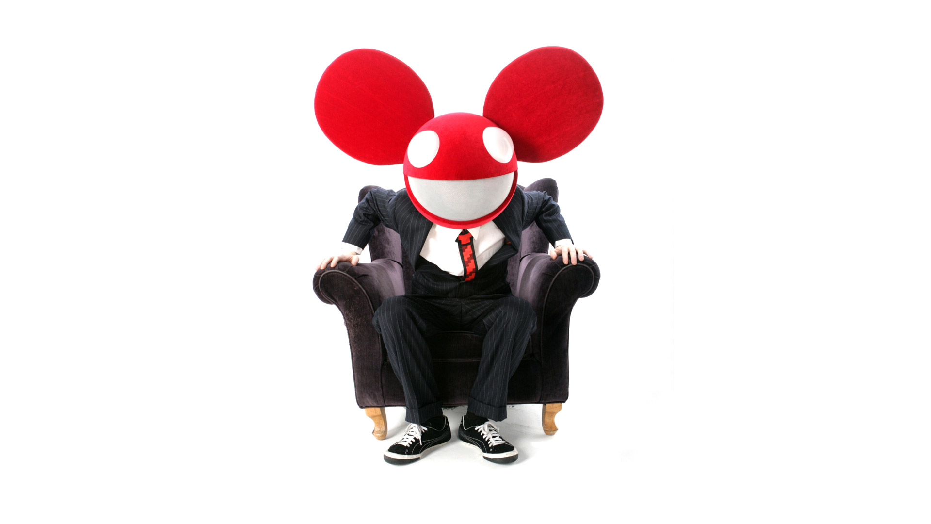 Deadmau5 in a suit sitting in a chair HD Wallpaper