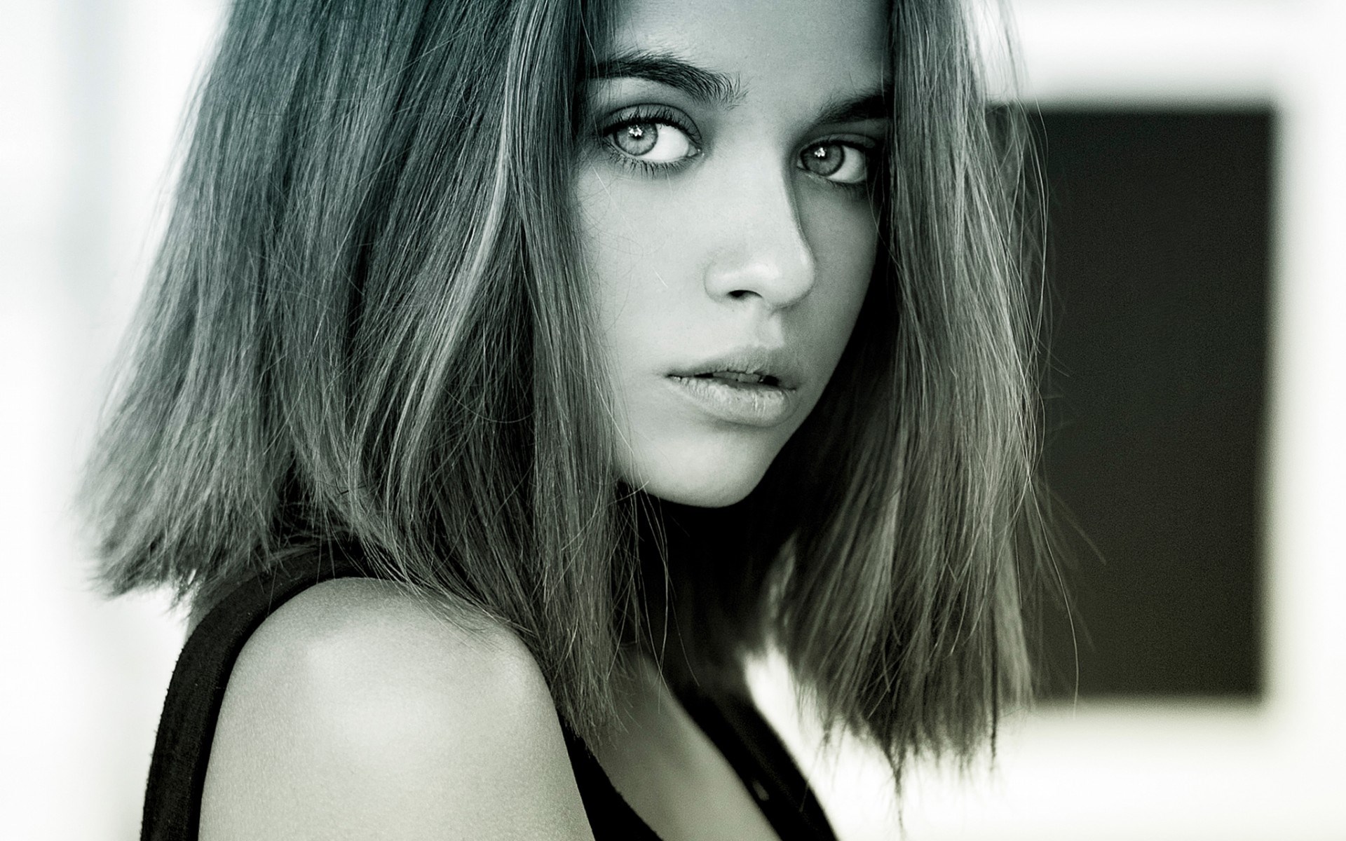 Woman with dark hair and light eyes HD Wallpaper
