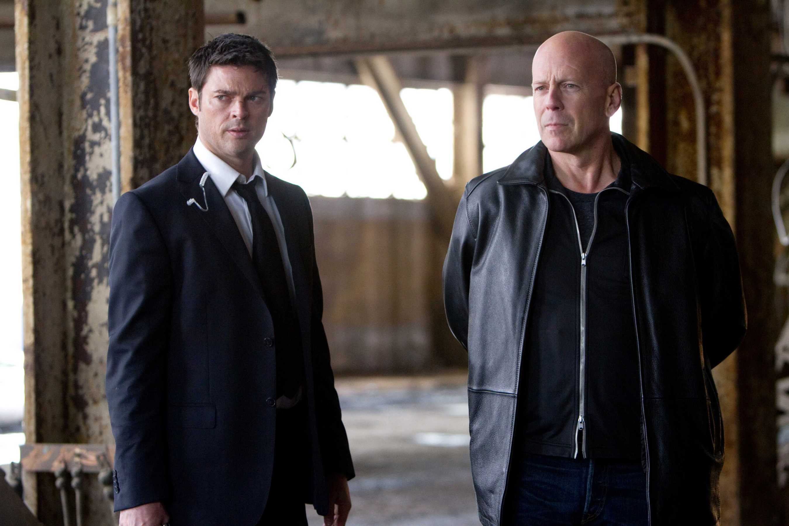Karl Urban and Bruce Willis in a warehouse HD Wallpaper