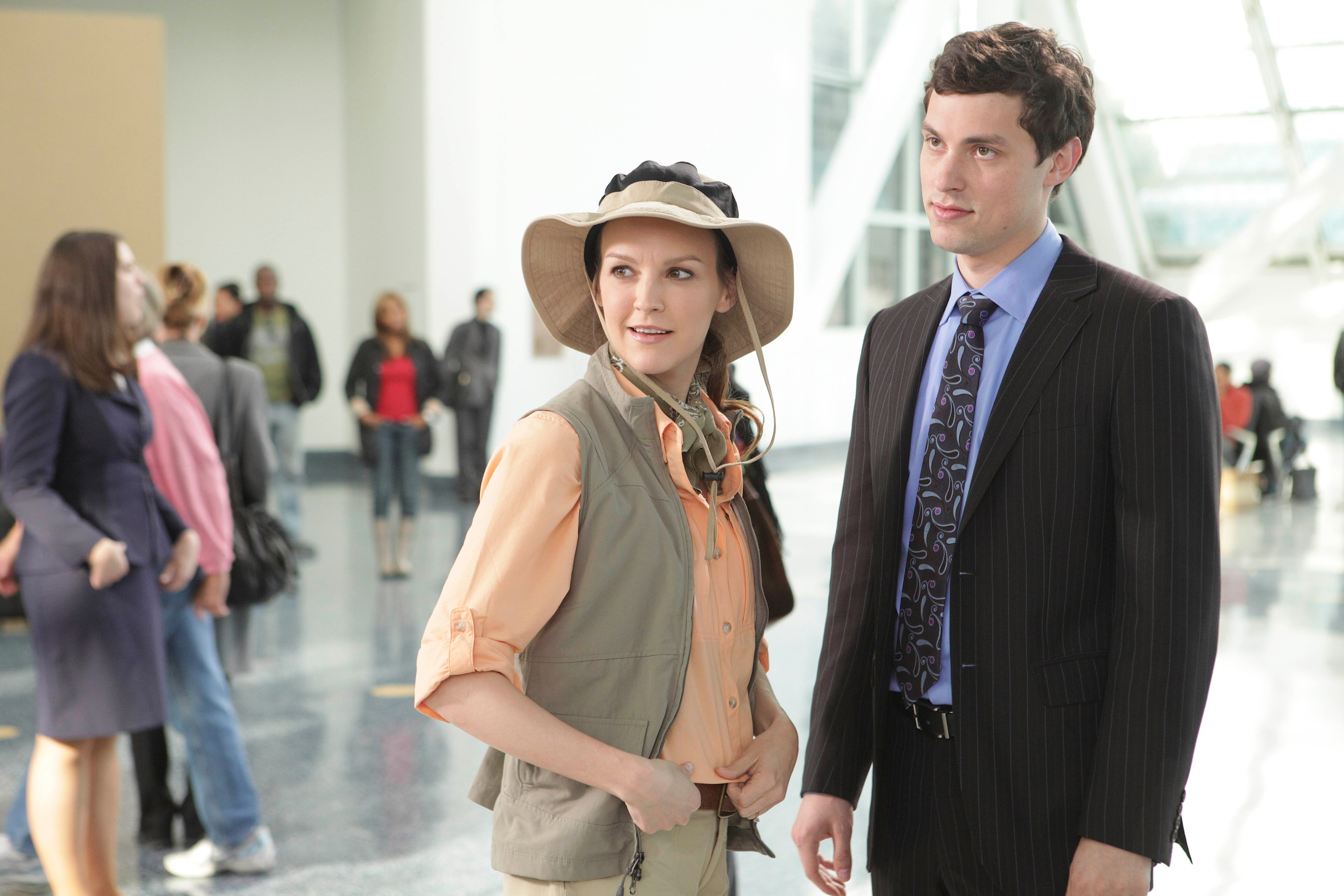 John Francis Daley in a suit and a woman in safari attire HD Wallpaper