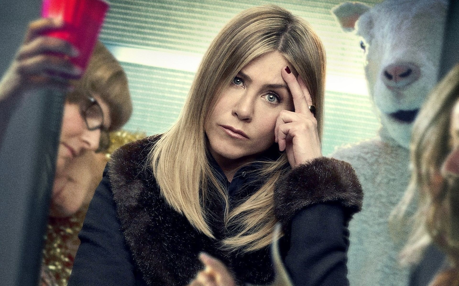 Jennifer Aniston in a dark coat with fur trim HD Wallpaper