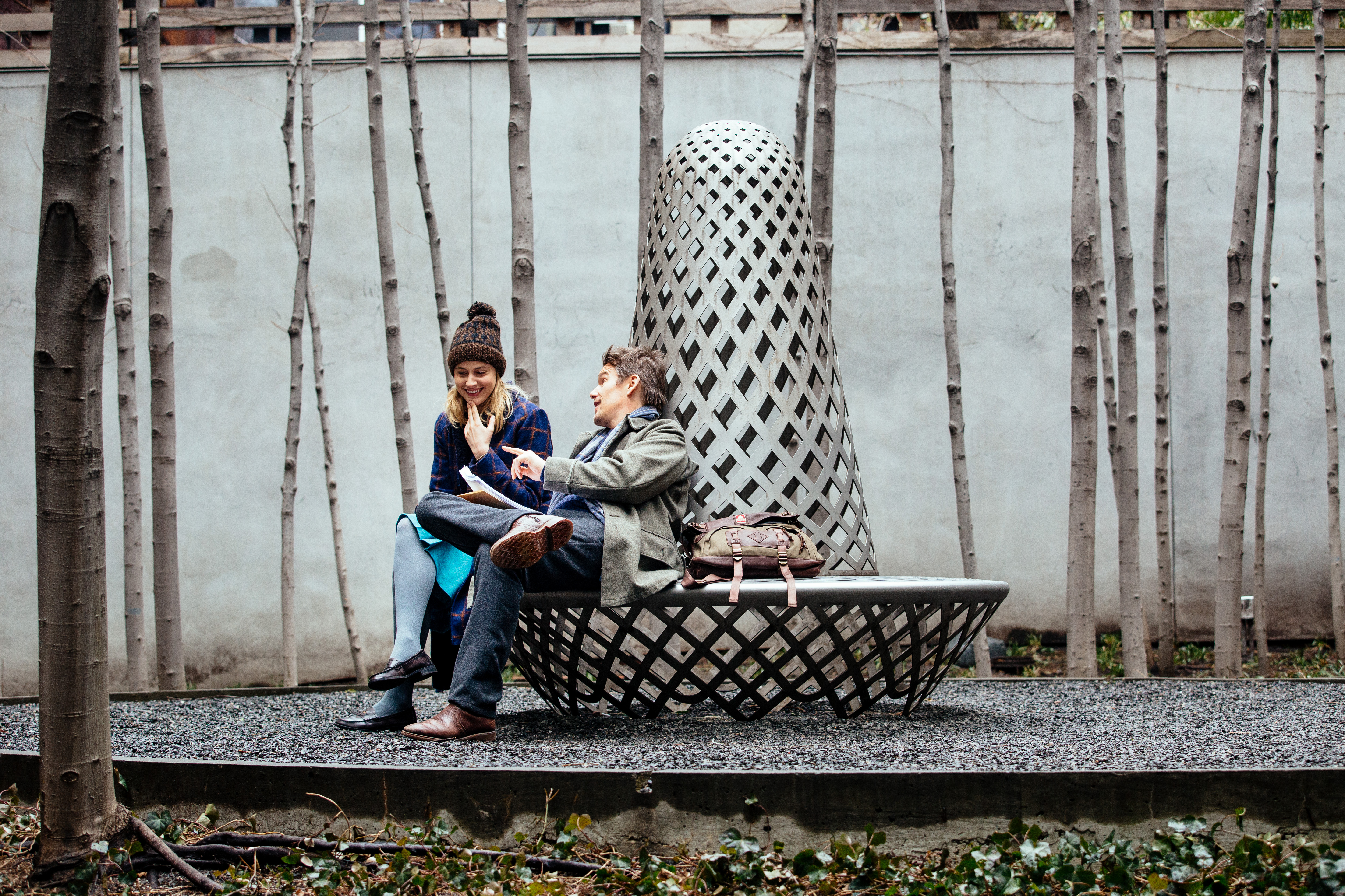 Greta Gerwig and man sitting on bench HD Wallpaper