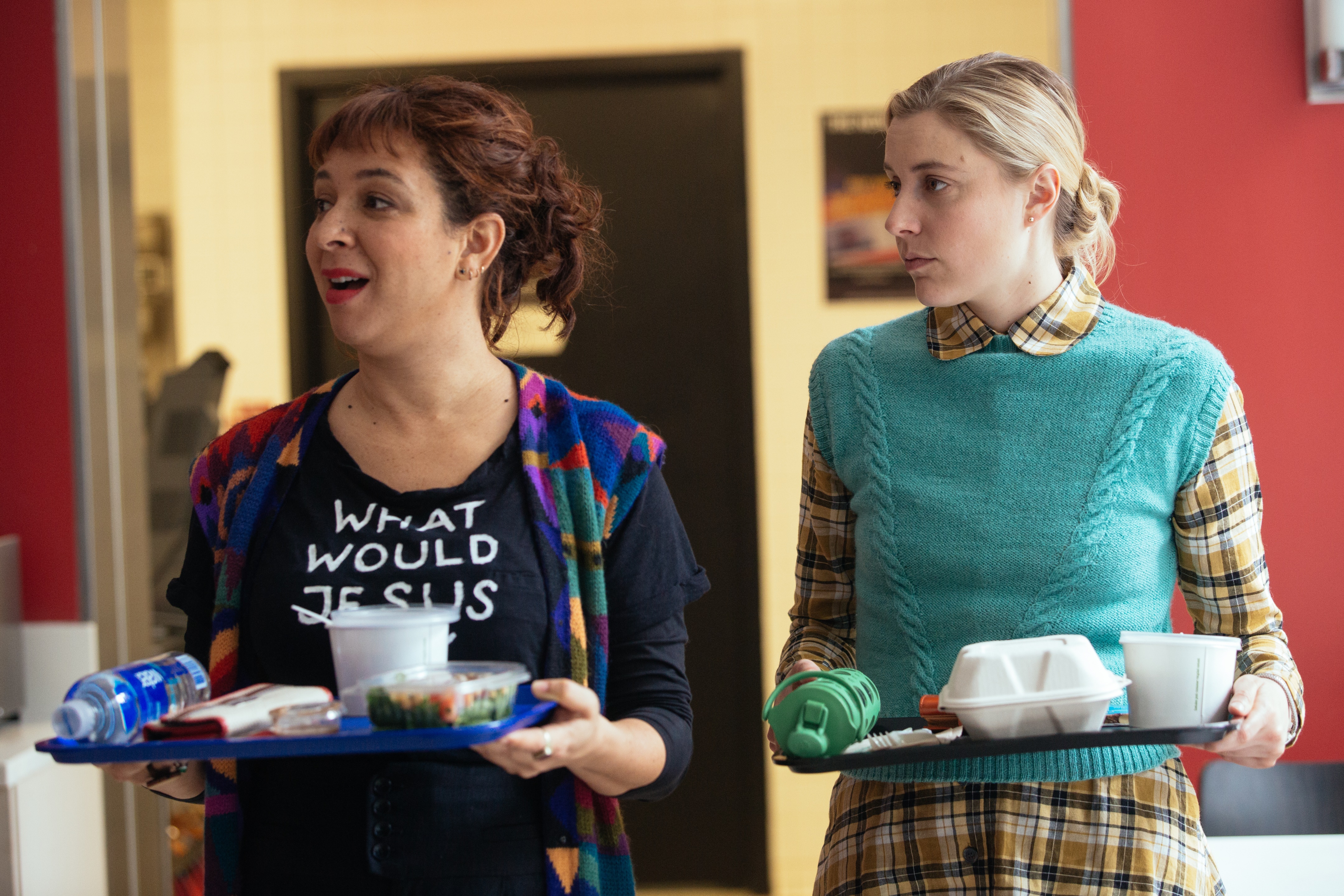 Greta Gerwig holding a lunch tray HD Wallpaper