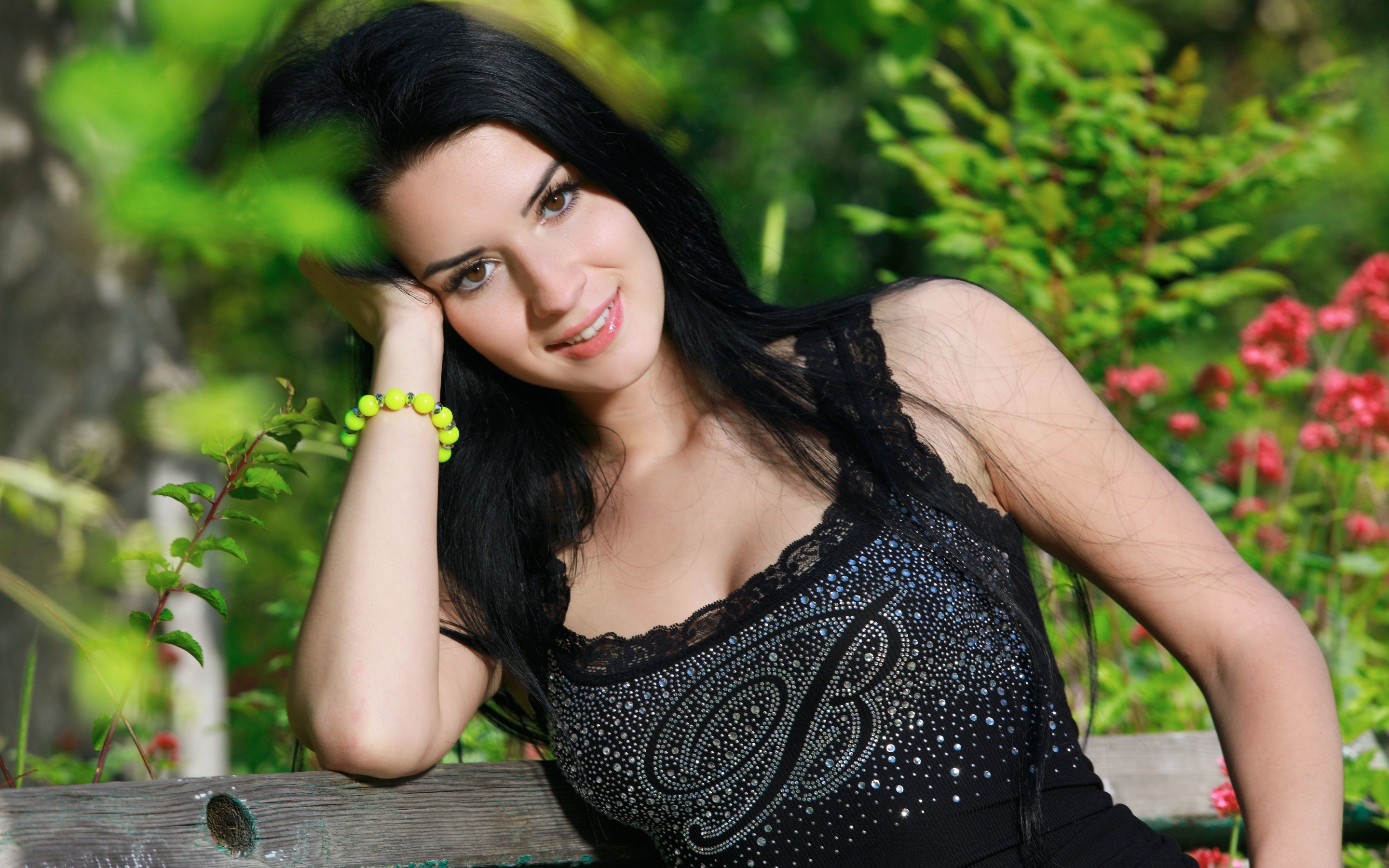Woman with black hair wearing a black top HD Wallpaper