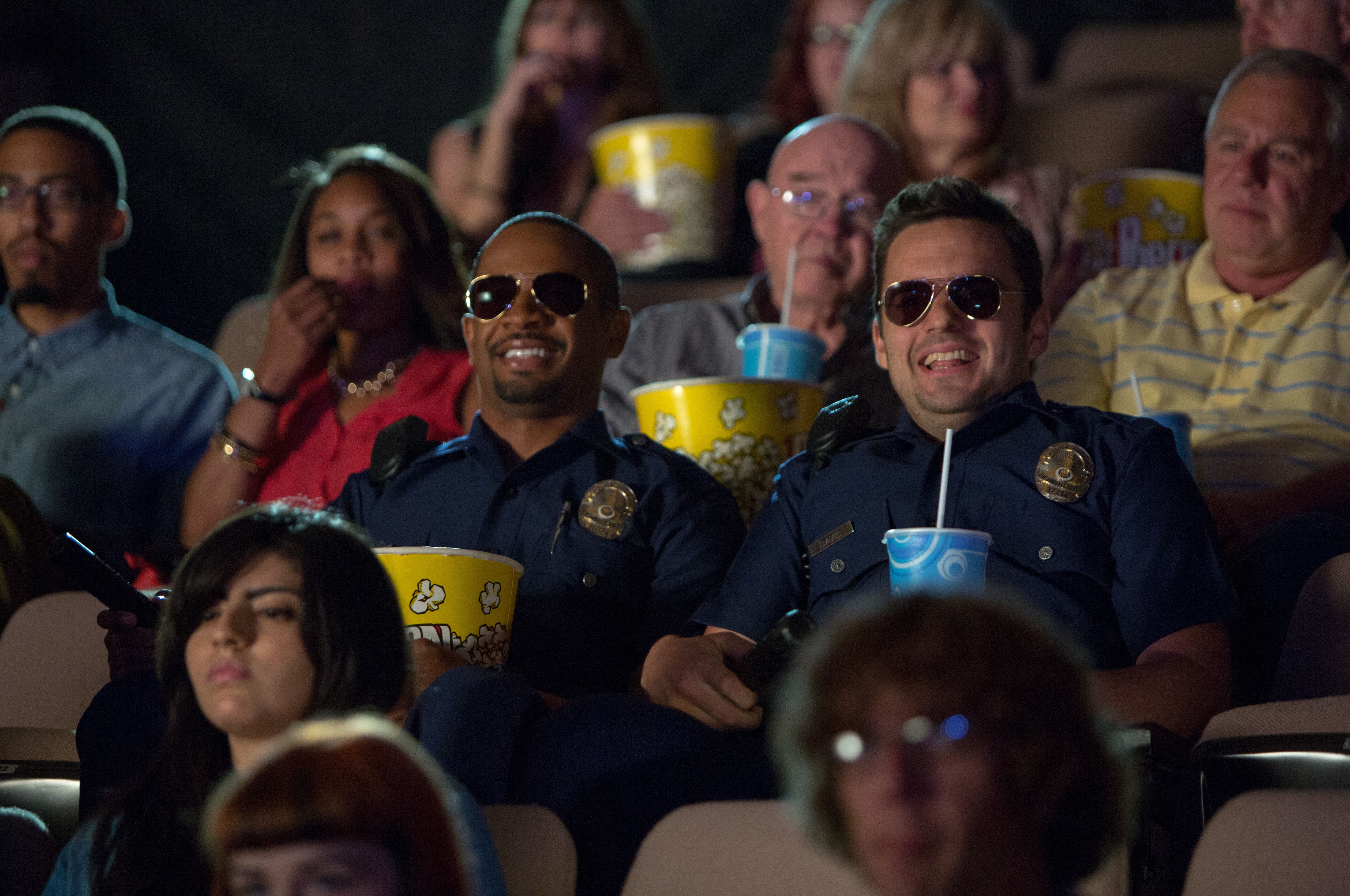 Two police officers watching a movie HD Wallpaper