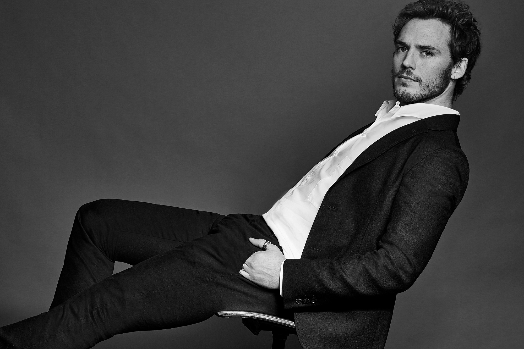 Sam Claflin in a suit HD Wallpaper