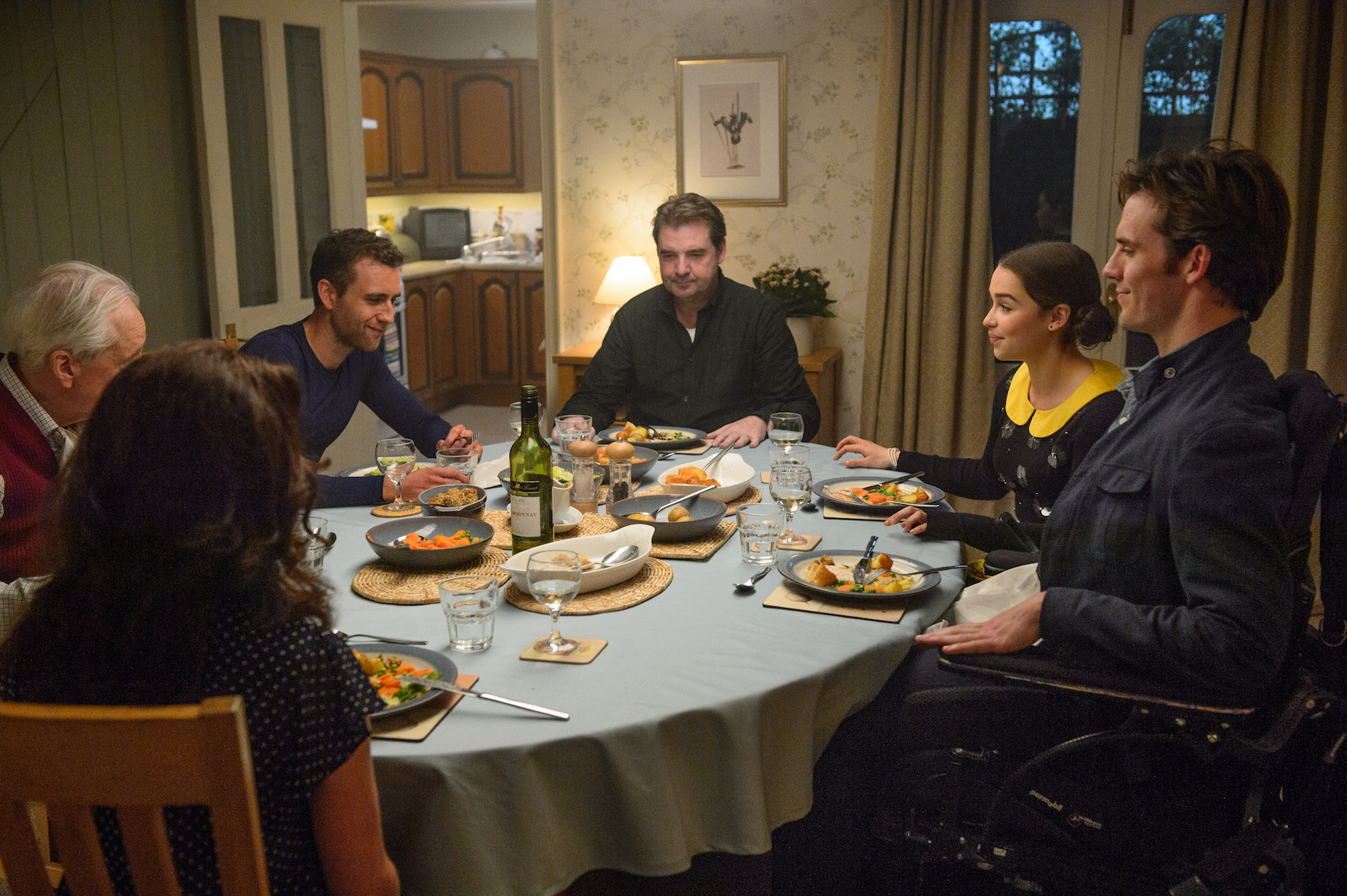 People having dinner at a table HD Wallpaper