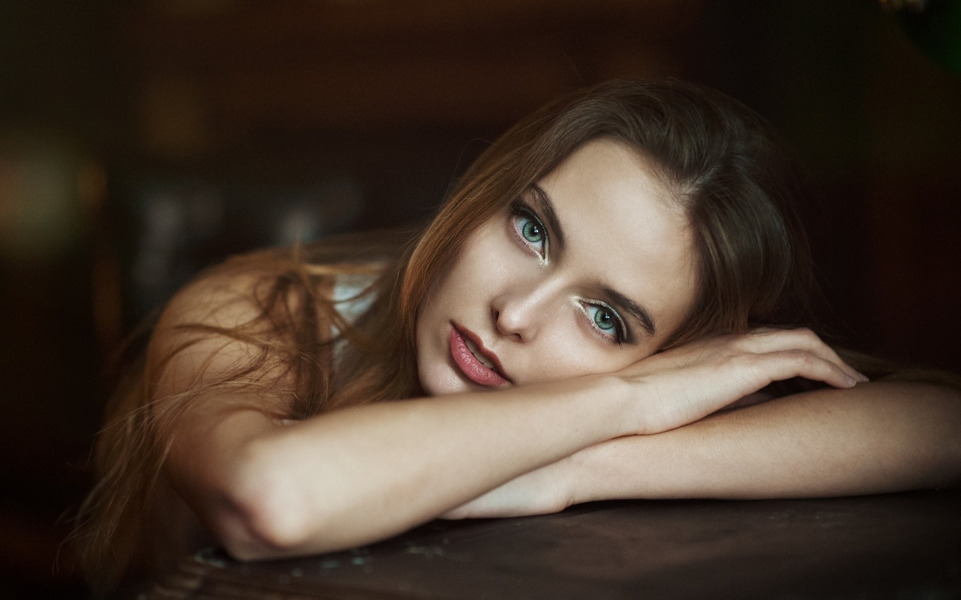 Woman resting her head on her arms HD Wallpaper